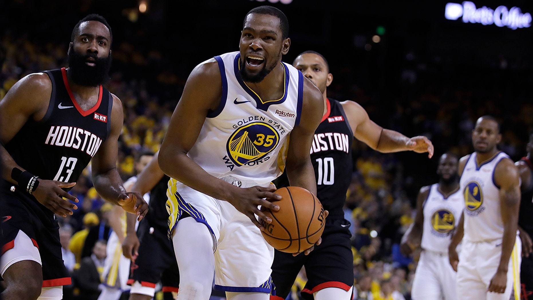 James Harden (left) of the Houston Rockets and Kevin Durant (35) of the Golden State Warriors react to the call of a referee during the second part of the fifth game of a series of playoffs NBA Second Round Basketball Championship, Wednesday, May 8, 2019, in Oakland, California. (AP Photo / Ben Margot)