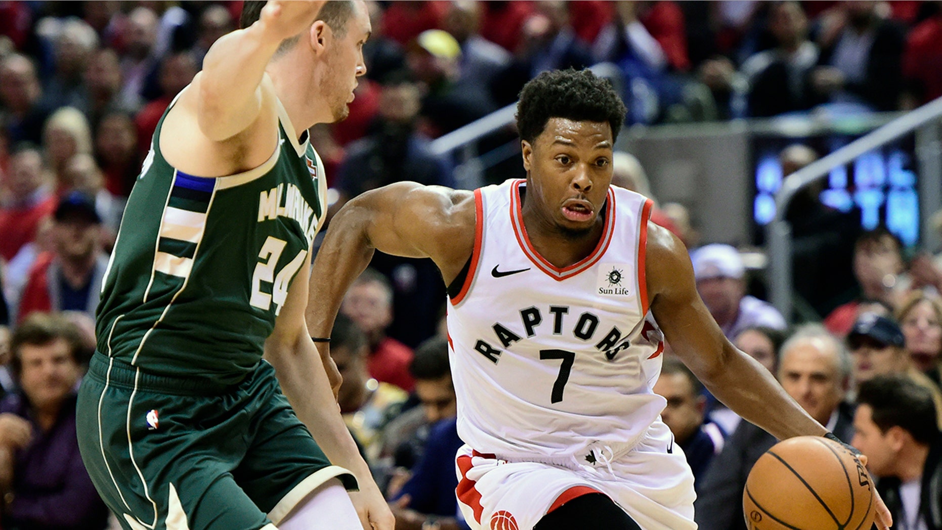 Toronto Raptors guard Kyle Lowry (7) drives for the basket as Milwaukee Bucks guard Pat Connaughton (24) defends during the second half of Game 4 of the NBA basketball playoffs Eastern Conference finals, Tuesday, May 21, 2019 in Toronto. (Frank Gunn/The Canadian Press via AP)