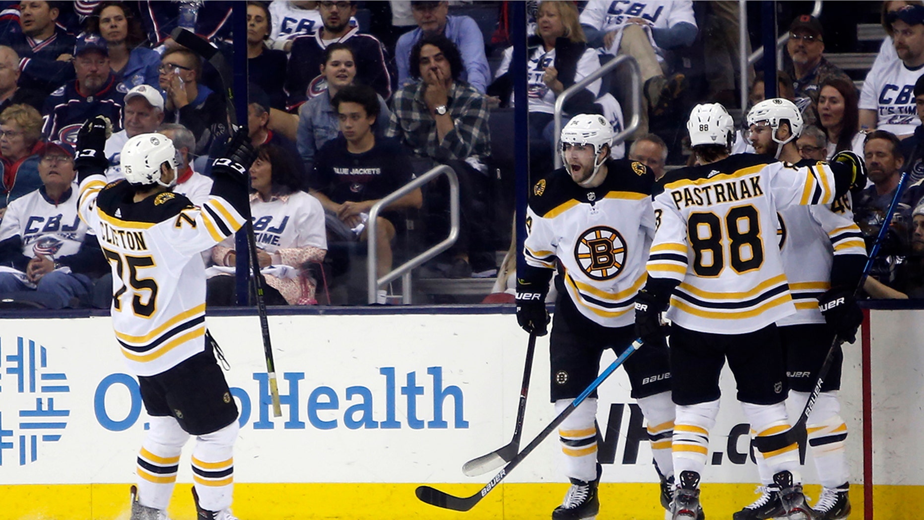 Boston Bruins players celebrate their goal against the Columbus Blue Jackets during the second period of Game 6 of an NHL hockey second-round playoff series Monday, May 6, 2019, in Columbus, Ohio. (AP Photo/Jay LaPrete)