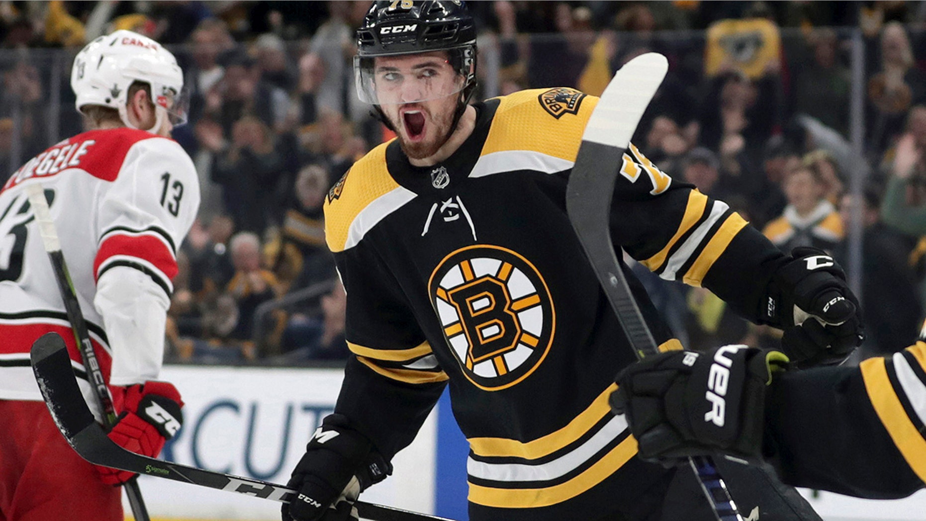 Boston Bruins' Connor Clifton (75) celebrates his goal against the Carolina Hurricanes during the second period in Game 2 of the NHL hockey Stanley Cup Eastern Conference final series, Sunday, May 12, 2019, in Boston. (AP Photo/Charles Krupa)