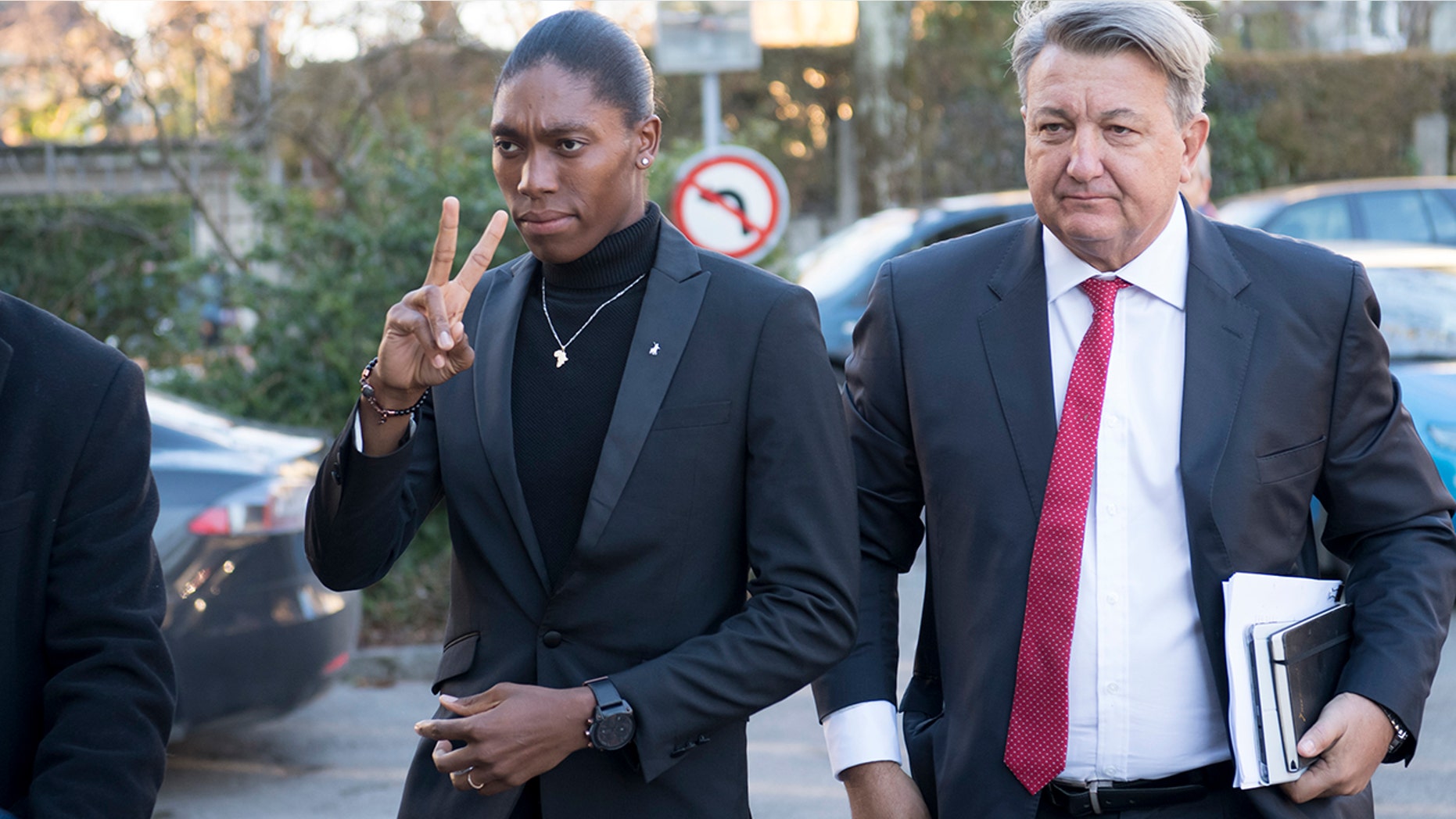 Caster Semenya, left, current 800-meter Olympic gold medalist and world champion, and her lawyer Gregory Nott, right, arrive for the first day of a hearing at the international Court of Arbitration for Sport, CAS, in Lausanne, Switzerland. (Laurent Gillieron/Keystone via AP, File)