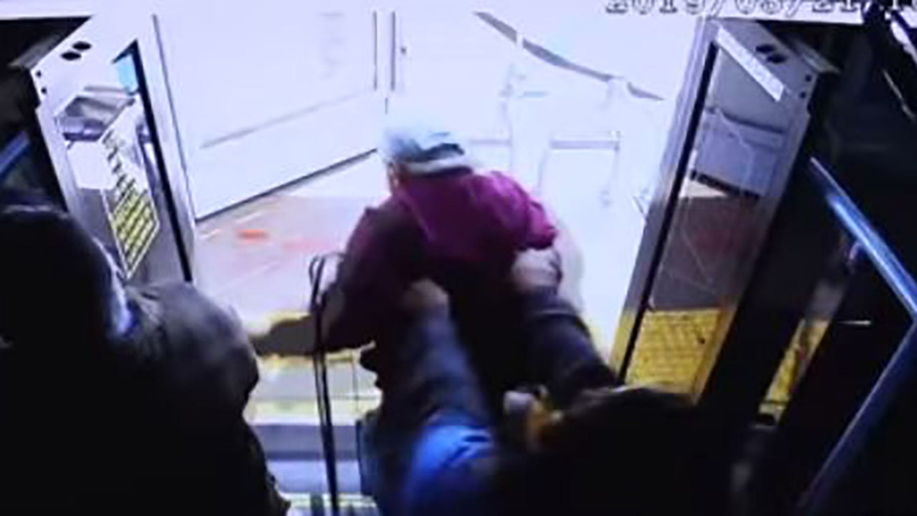 The surveillance video shows that Bishop pushed Fournier through the door of the stopped bus. 