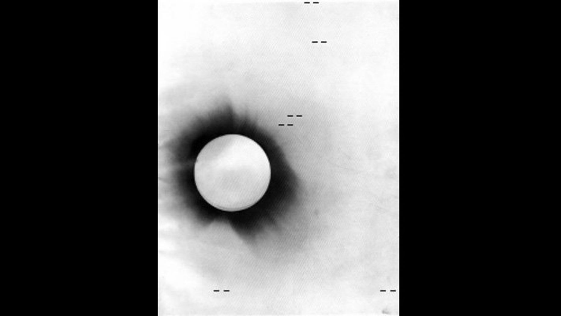 Negative photo of the 1919 solar eclipse taken from Príncipe Island. The position of the stars that were examined in the historic test of Einstein's theory of gravity are marked in this photo.