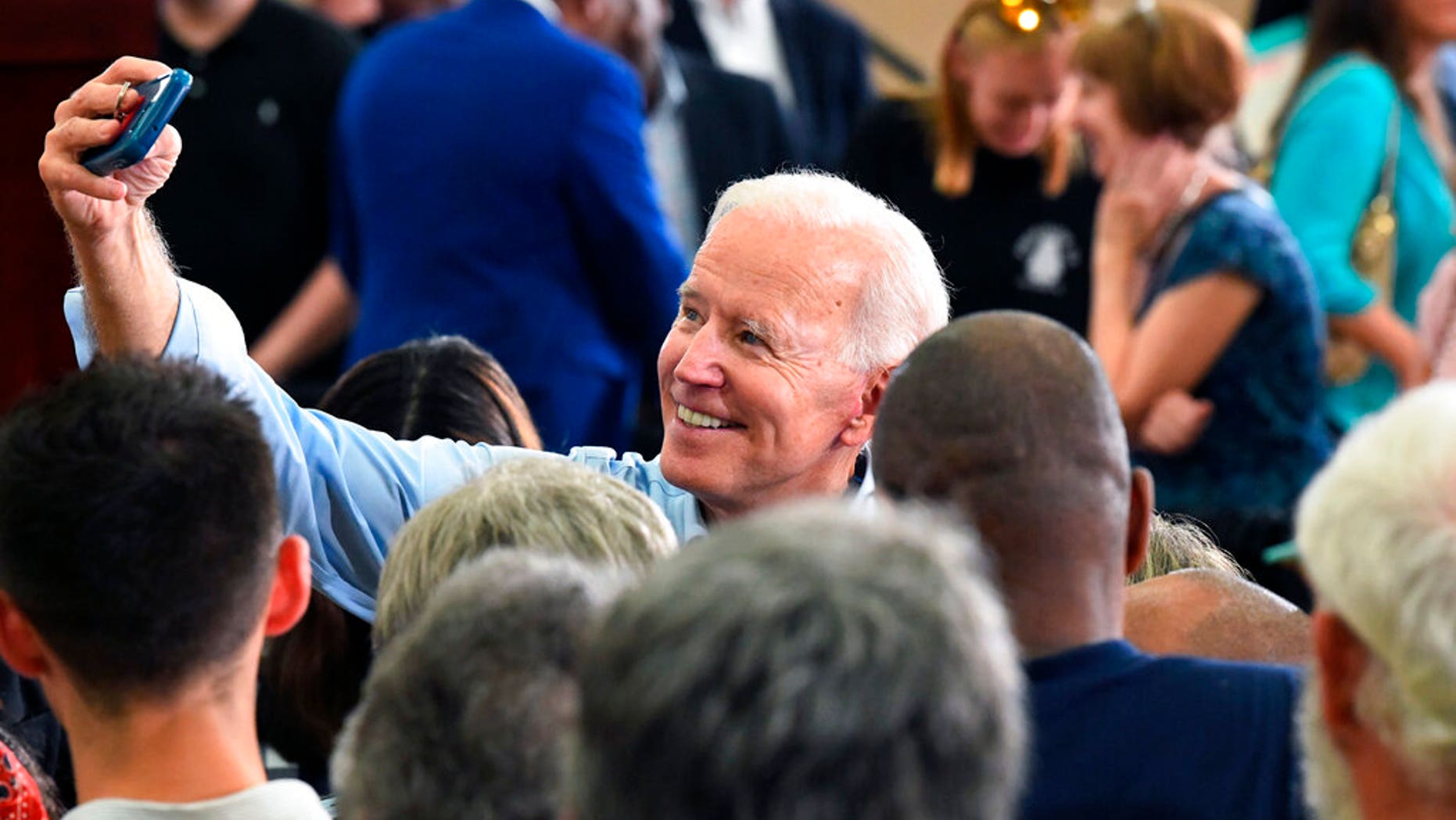 Former Vice President Joe Biden takes photos with supporters following the first rally of his 2020 campaign, Saturday,. in Columbia, S.C. (AP Photo/Meg Kinnard)