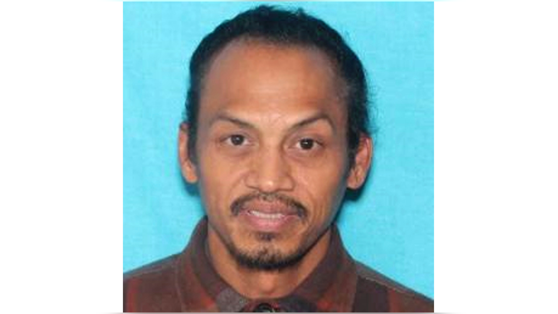 This undated booking photo provided by the Idaho State Police shows Jonathan Llana, 45. A search was underway Thursday, May 23, 2019 in southern Idaho for Llana, suspected of shooting and killing a motorist on a Utah highway, Idaho State Police said in a statement. (Idaho State Police via AP)