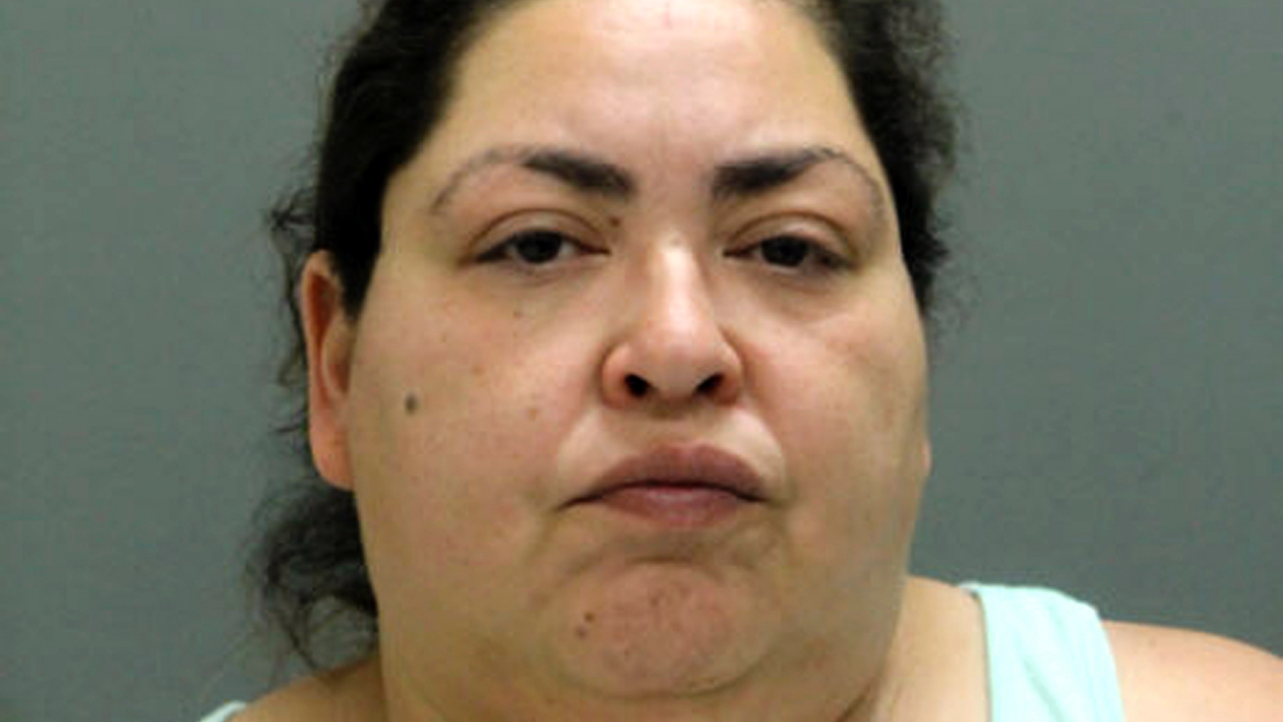 This booking photo provided by the Chicago Police Department, Thursday, May 16, 2019, shows Clarisa Figueroa, who is charged in the death of 19-year-old expectant mother Marlen Ochoa-Lopez. First-degree murder charges have been filed against Figueroa and her daughter Desiree Figueroa in connection with the death of Ochoa-Lopez, whose body was discovered earlier in the week, strangled before her baby was cut from her womb. (Chicago Police Department via AP)
