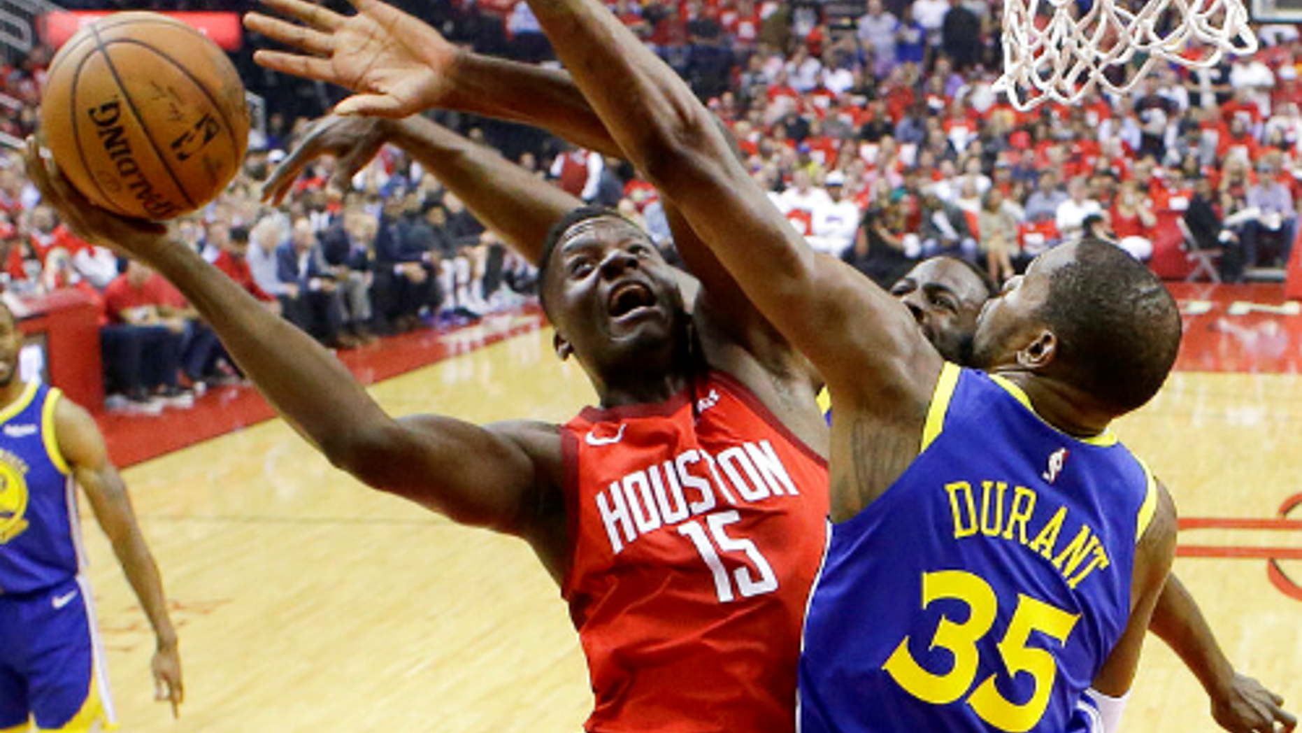 Houston Rockets center Clint Capela (15) shoots as Golden State Warriors forward Kevin Durant (35) defends during the first half of Game 4 of a second-round NBA basketball playoff series.