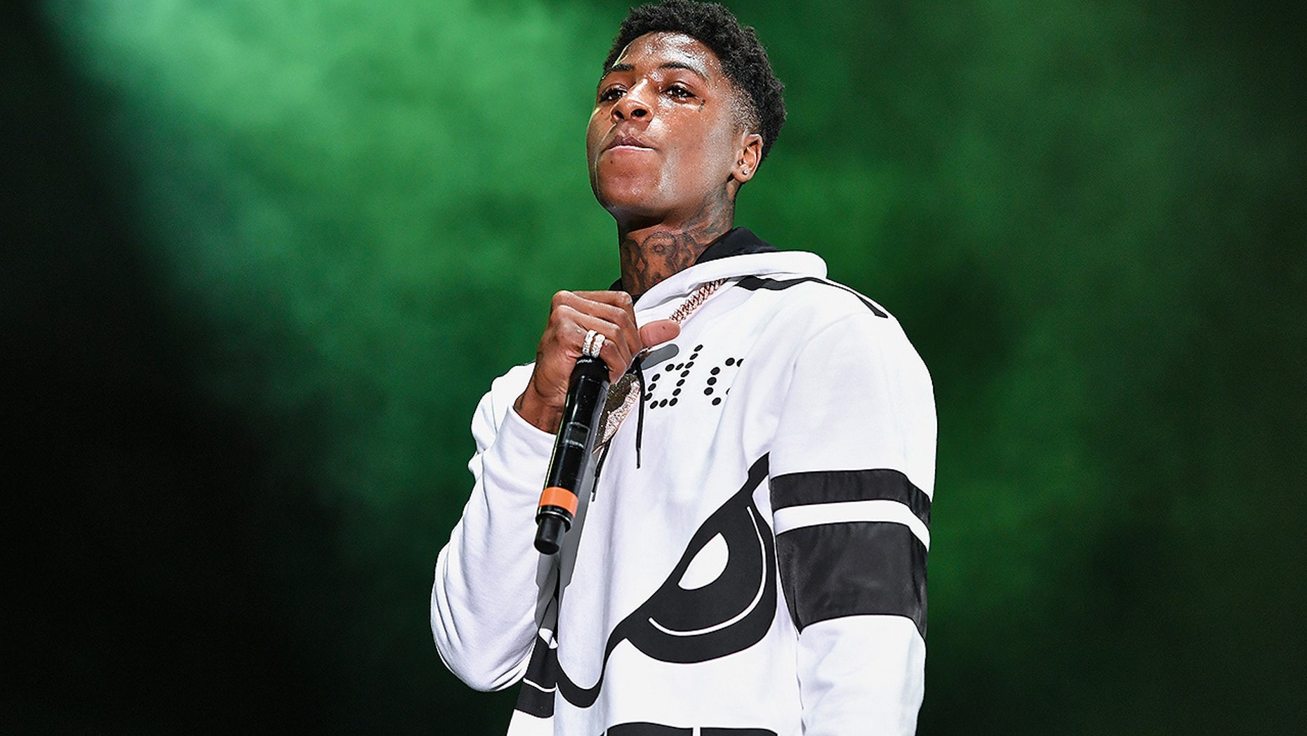 The rapper NBA Youngboy's girlfriend was injured in a deadly shootout in Miami. The scrum would have occurred outside of a Trump complex.