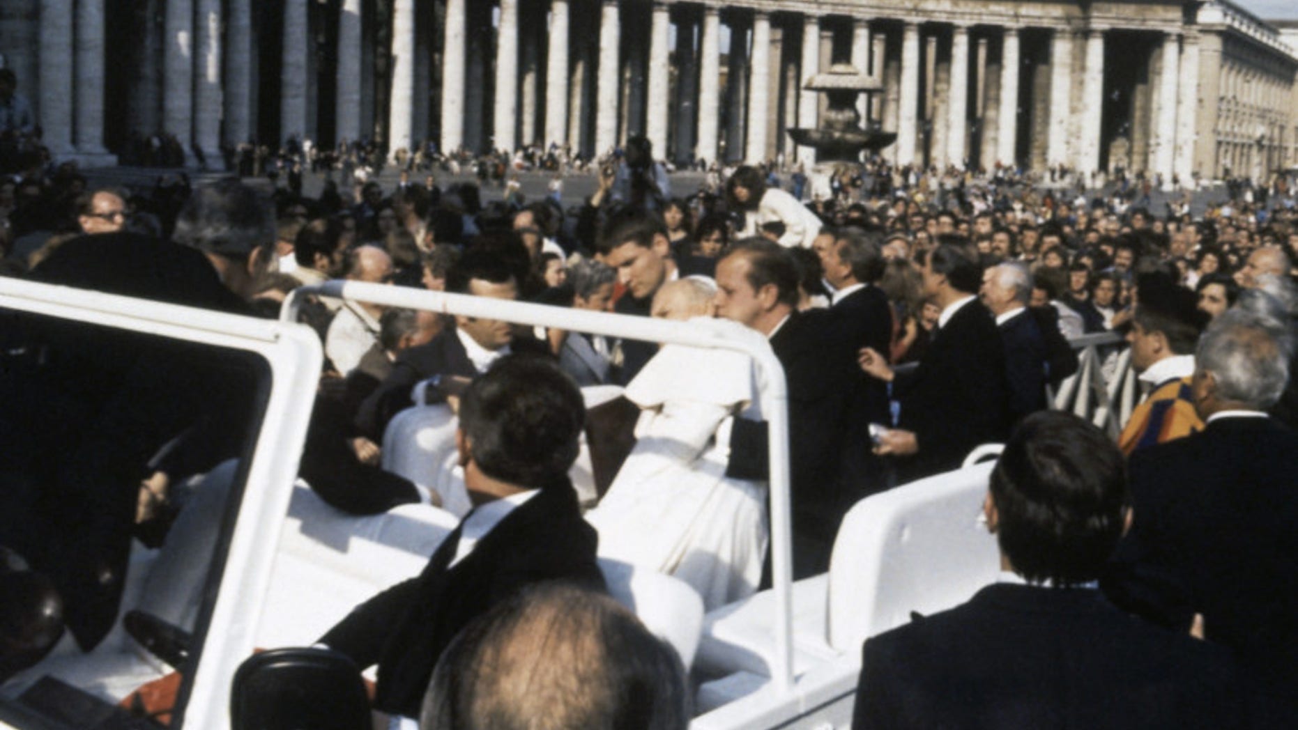 Pope John Paul II is held up by his secretary, Stanislaw Dziwisz after being shot at by Turkish student Ali Acga and seriously wounded in Vatican City on May 13, 1981. The Assassination attempt took place during the regular general audience in St. Peter's Square on Wednesday. (AP Photo/Arturo Mari)