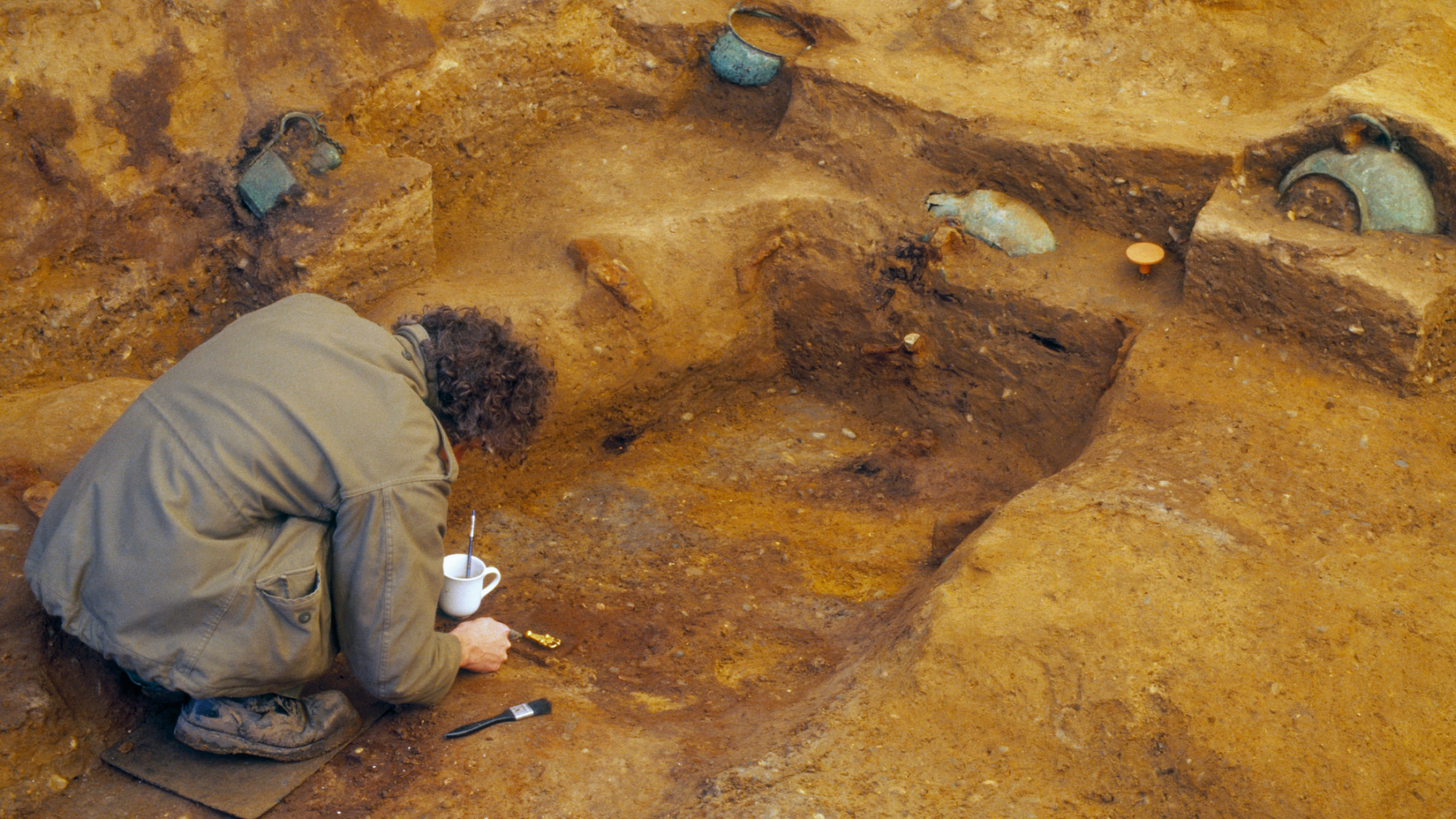 An archaeologist carefully excavates the Prittlewell burial chamber. The chamber was discovered in 2003; it has taken researchers 16 years to carefully remove, clean and analyze the artifacts. Many will now be on permanent display at the Southend Central Museum in Southend-on-Sea, England.