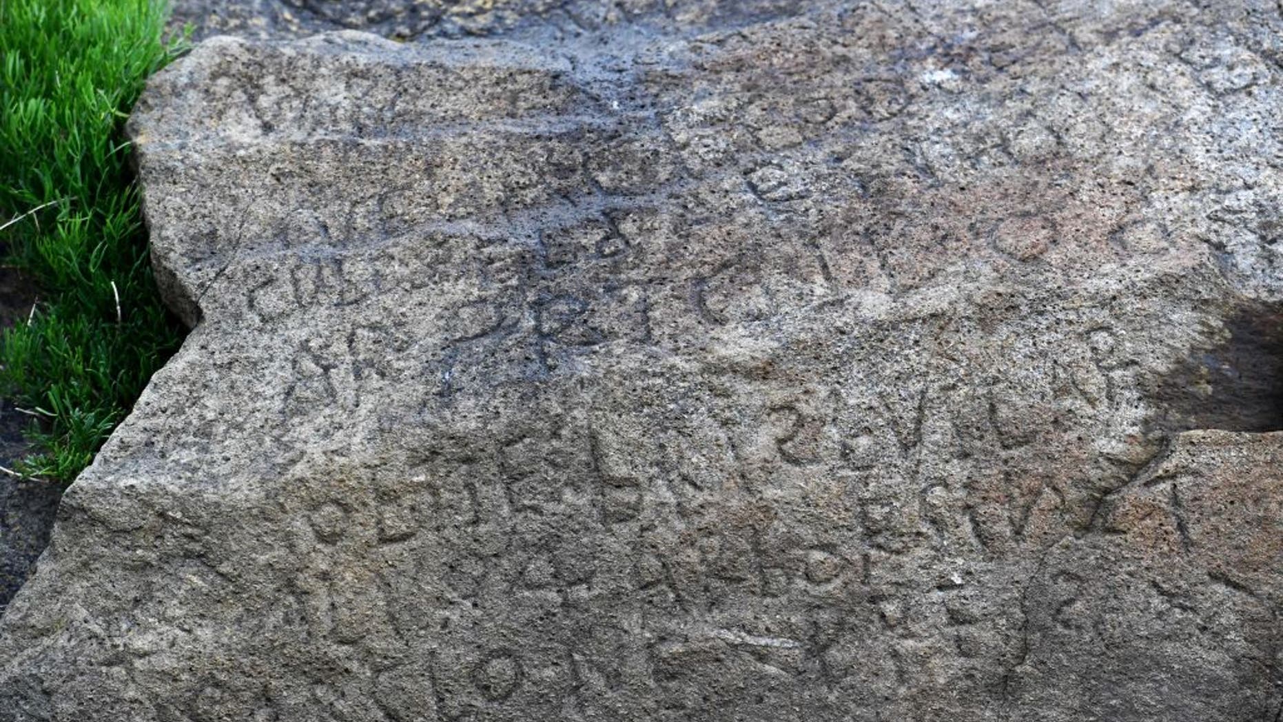 At low-tide, a rock inscribed with a 230-year-old code emerges on a beach in France. The town where it's located is now offering a bounty to anyone who can decipher the writing inscribed there.
