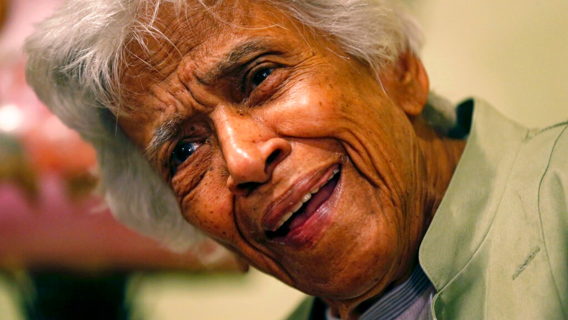 Leah Chase speaks at her family's restaurant, Dooky Chase's Restaurant, in New Orleans in 2015. The legendary chef and civil rights icon has died at 96, according to a statement her family released to news outlets. (AP Photo/Gerald Herbert, File)