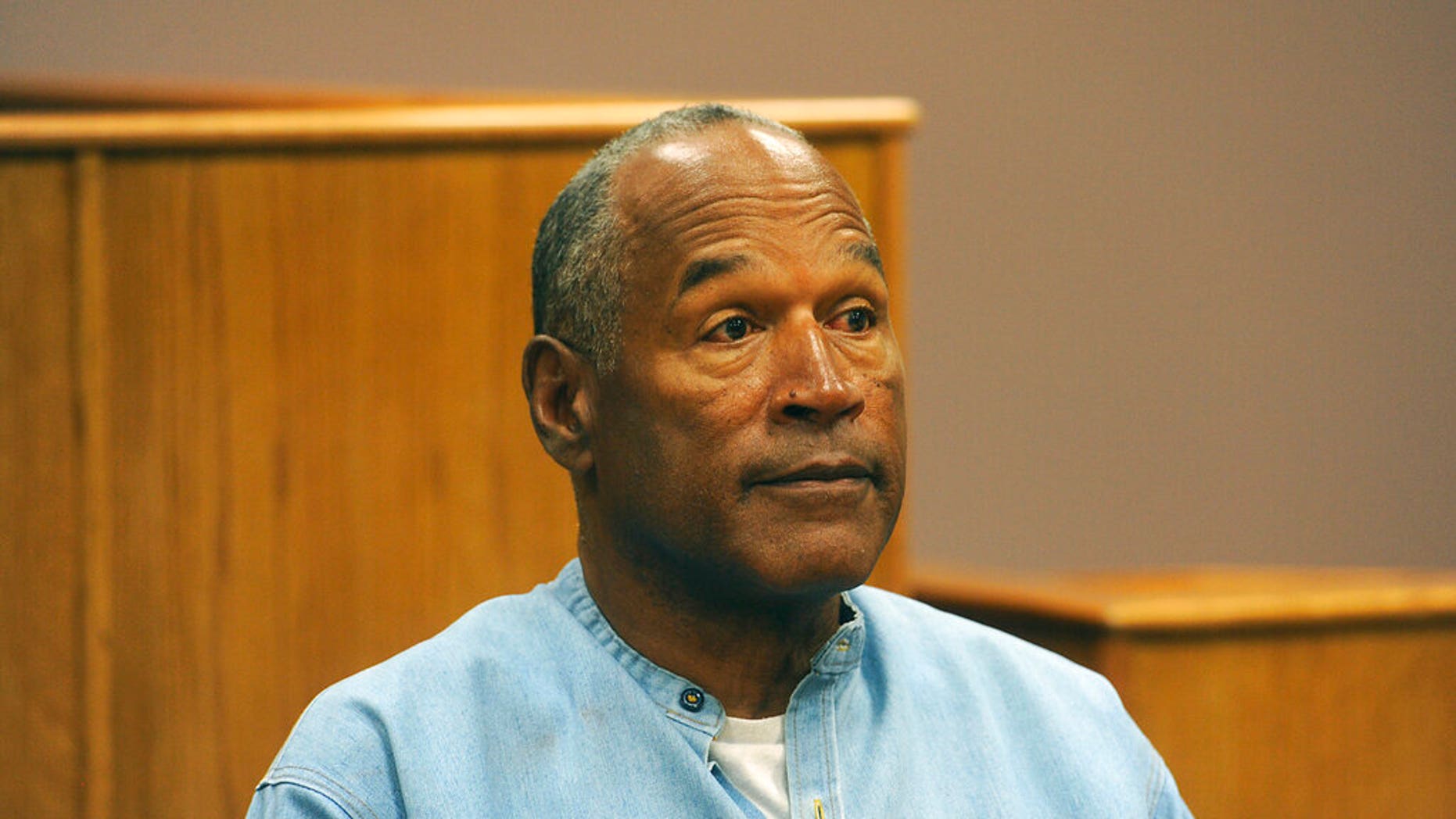 FILE: Former NFL football star O.J. Simpson appears via video for his parole hearing at the Lovelock Correctional Center in Lovelock, Nev. 