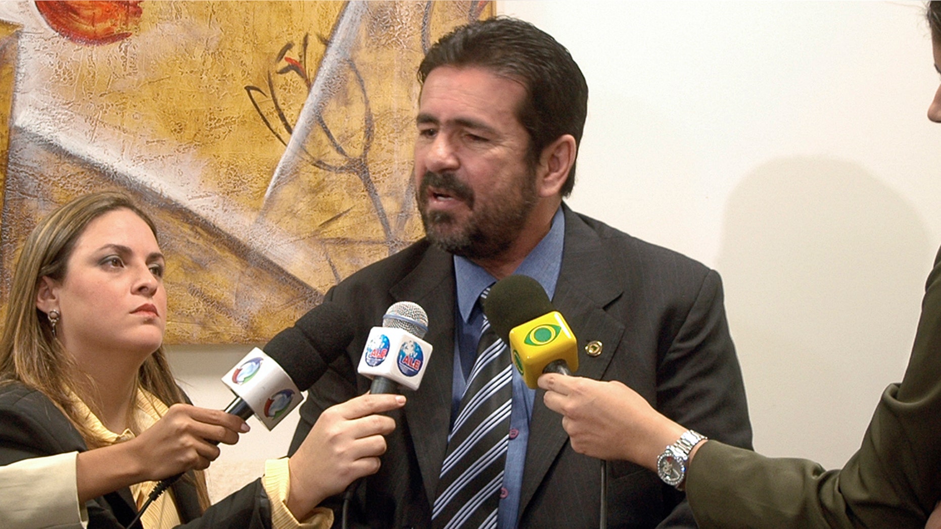 Late television show host Wallace Souza, center, seen here speaking during a news conference in Manaus, Brazil, Tuesday, Aug. 11, 2009. Brazilian police were investigating Souza on suspicion of commissioning at least five of the murders depicted in his shows to boost his ratings and prove his claim that Brazil's Amazon region is awash in violent crime. (AP Photo/A Critica, Antonio Menezes)
