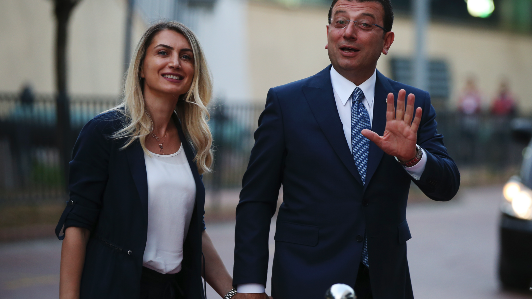 Istanbul's mayoral candidate Ekrem Imamoglu, candidate of the secular opposition Republican People's Party, or CHP, accompanied by his wife, name not given, arrives for a televised debate with Binali Yildirim, of Turkey's ruling Justice and Development Party, or AKP, ahead of the June 23 re-run of Istanbul elections, Sunday, June 16, 2019. Televised election debates are uncommon in Turkey. The last one, between AKP leader Recep Tayyip Erdogan and the then-leader of the CHP, took place before a 2002. The AKP has been in power since. (AP Photo/Emrah Gurel)