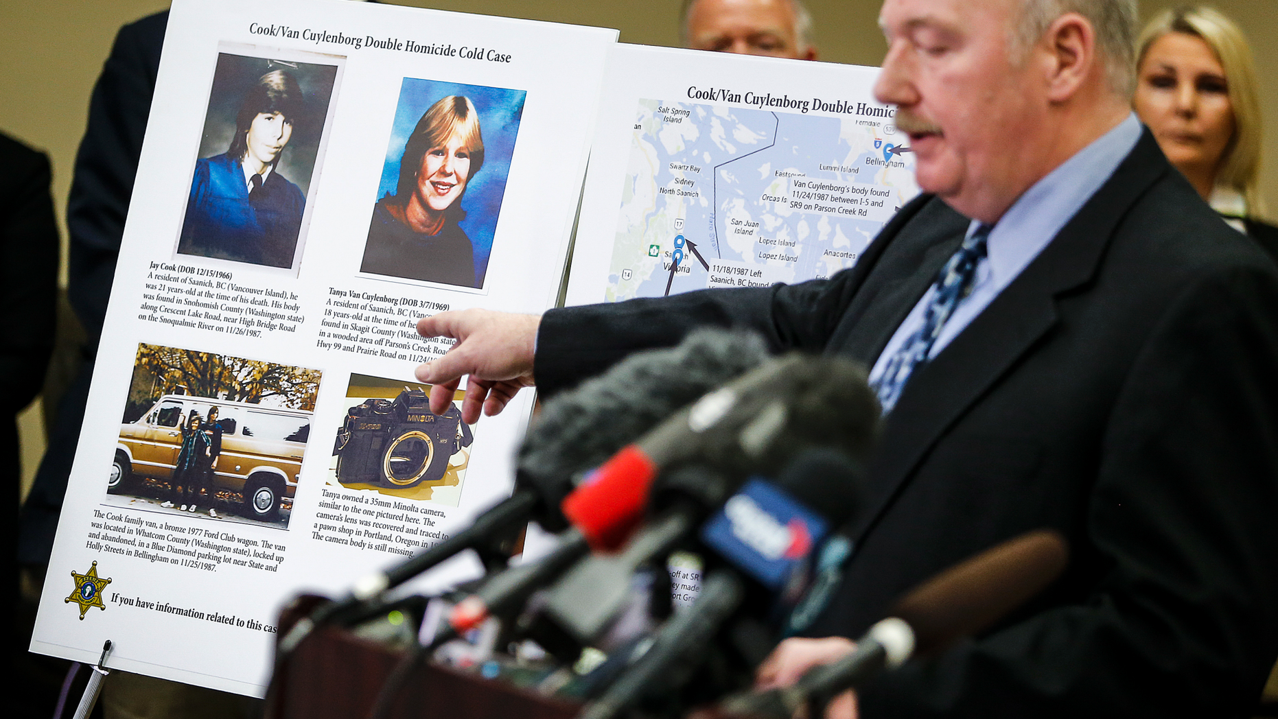 FILE - In this April 11, 2018, file photo, Snohomish County Cold Case Detective Jim Scharf, right, shares details of the unsolved case of the 1987 double homicide of Jay Cook and Tanya Van Cuylenborg, during a press conference in Everett, Wash. William Earl Talbott II charged in the slayings of the young Canadian couple is facing trial in Washington state this week. (Ian Terry/The Herald via AP, File)