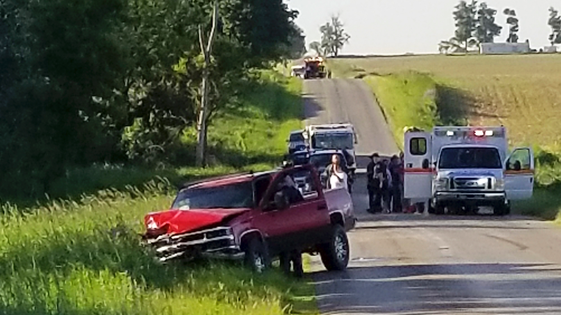 A damaged truck sits on the side of the road after an accident involving a horse-drawn carriage on Friday, June 7, 2019 in California Township, Mich. Michigan State Police said the pick up truck was headed southbound when the driver rear ended an Amish, horse-drawn carriage. Two adults and five children were ejected from the carriage. (Don Reid/The Daily Reporter via AP)