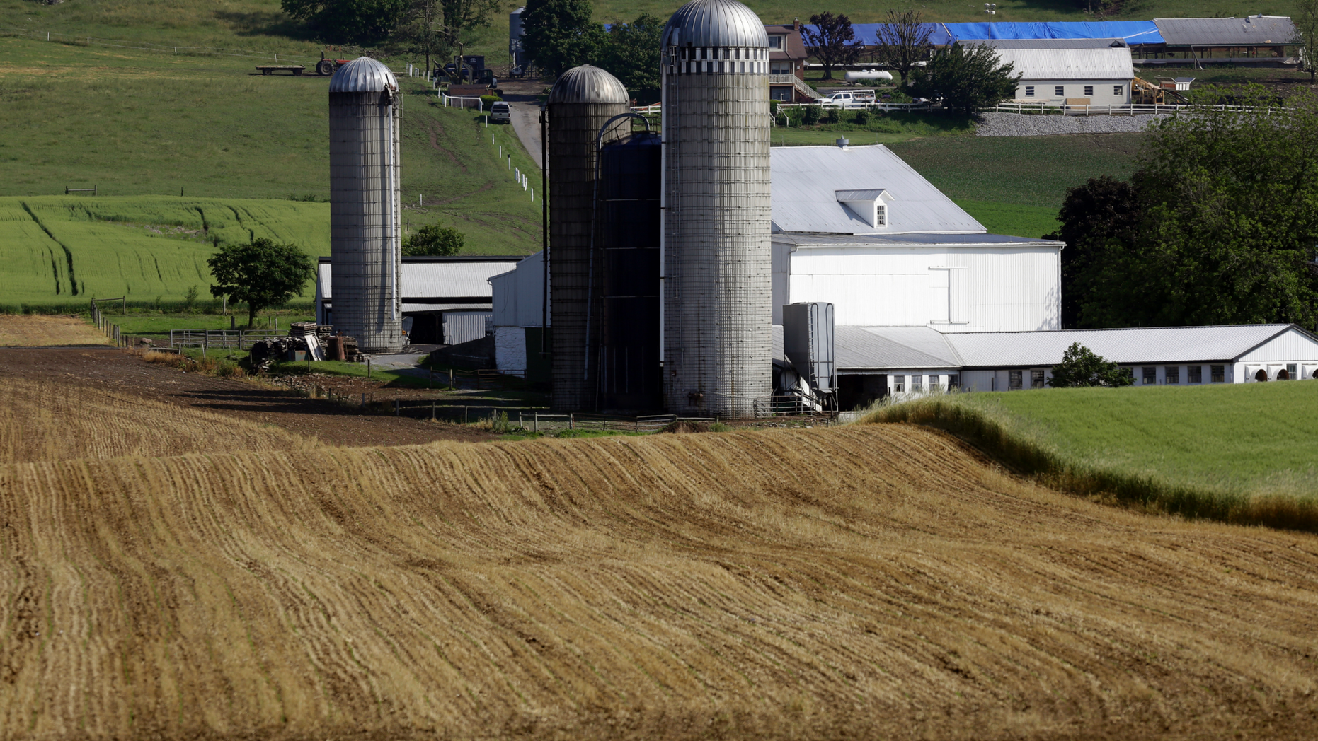 FILE- This May 29, 2019, file photo shows a farm outside Morgantown, Pa. On Tuesday, June 11, the Labor Department reports on U.S. producer price inflation in May. (AP Photo/Jacqueline Larma, File)