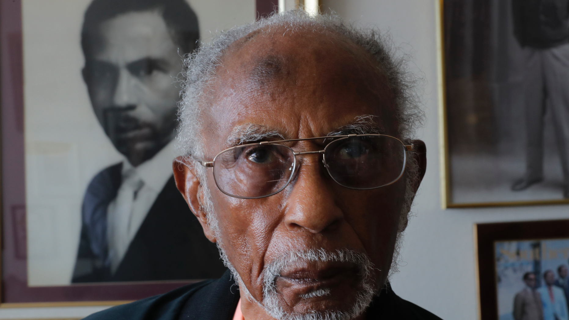 World War II veteran Johnnie Jones, Sr. poses for a portrait at his home in Baton Rouge, La., Tuesday, May 28, 2019. Jones, who joined the military in 1943 out of Southern University in Baton Rouge, was a warrant officer in a unit responsible for unloading equipment and supplies onto Normandy. He remembers wading ashore and one incident when he and his fellow soldiers came under fire from a German sniper. He grabbed his weapon and returned fire along with the other soldiers. It's something that still haunts his memories. (AP Photo/Gerald Herbert)