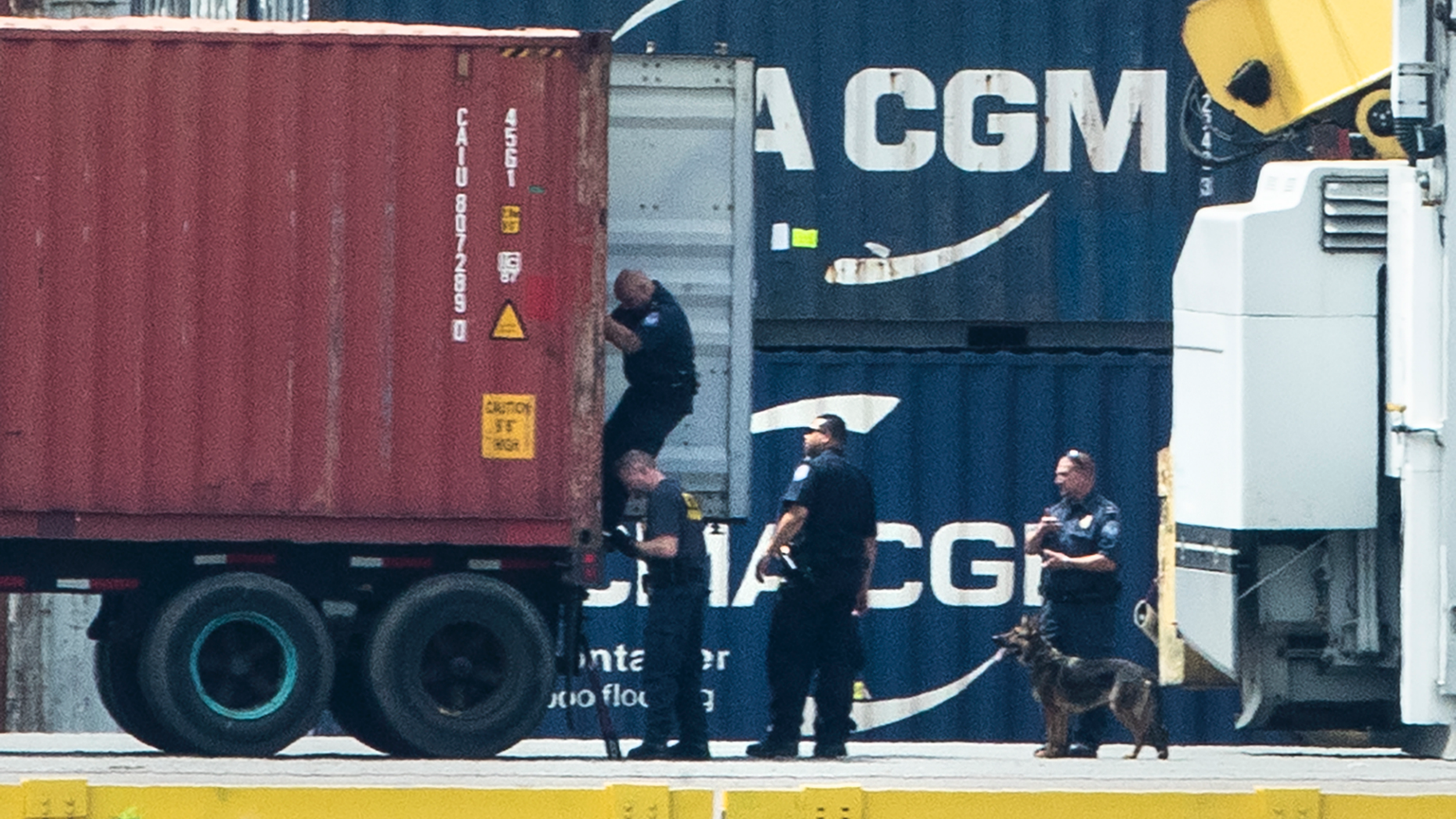 Authorities search a container along the Delaware River in Philadelphia, Tuesday, June 18, 2019. U.S. authorities have seized more than $1 billion worth of cocaine from a ship at a Philadelphia port, calling it one of the largest drug busts in American history. The U.S. attorney’s office in Philadelphia announced the massive bust on Twitter on Tuesday afternoon. Officials said agents seized about 16.5 tons (15 metric tons) of cocaine from a large ship at the Packer Marine Terminal. (AP Photo/Matt Rourke)
