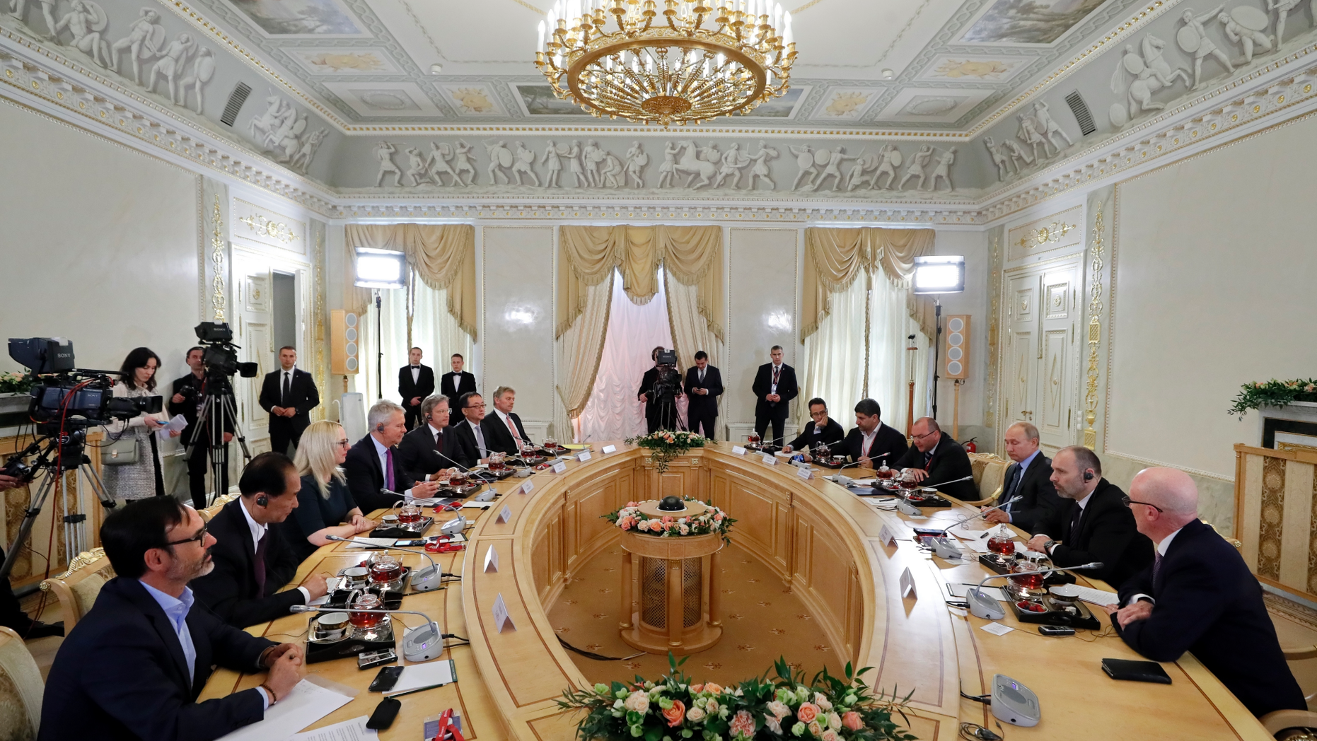 Russian President Vladimir Putin, third right, speaks during a meeting with heads of world's leading news agencies at the St. Petersburg International Economic Forum in St. Petersburg, Russia, Thursday, June 6, 2019. (Yuri Kochetkov/Pool Photo via AP)