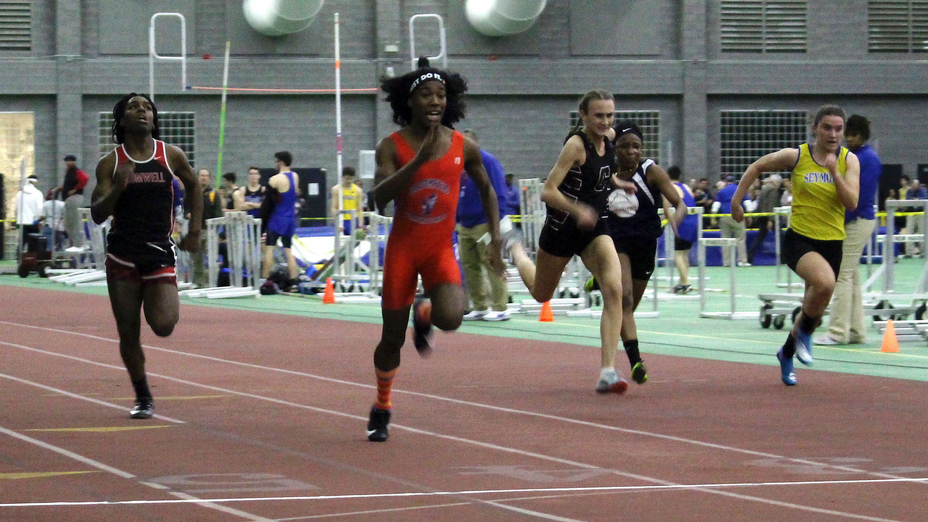 FILE - In this Feb. 7, 2019 file photo, Bloomfield High School transgender athlete Terry Miller, second from left, wins the final of the 55-meter dash over transgender athlete Andraya Yearwood, far left, and other runners in the Connecticut girls Class S indoor track meet at Hillhouse High School in New Haven, Conn. Three Connecticut girls who participate on high school track teams have filed a federal discrimination complaint against a statewide policy on transgender athletes, saying it has cost them top finishes in competitions and possibly college scholarships. (AP Photo/Pat Eaton-Robb, File)
