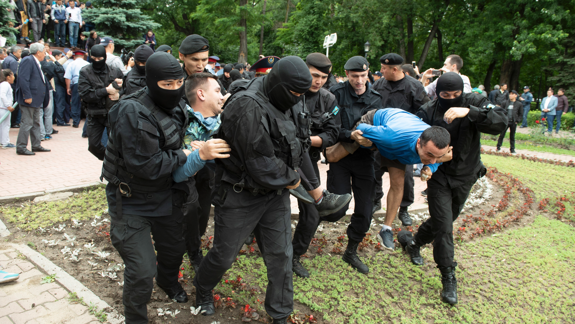 Kazakh police detain demonstrators during an anti-government protest during the presidential elections in Almaty, Kazakhstan, Sunday, June 9, 2019. Voters in Kazakhstan are choosing a successor to the president who had led the Central Asian country since independence from the Soviet Union, with a longtime loyalist expected to win easily. (AP Photo)