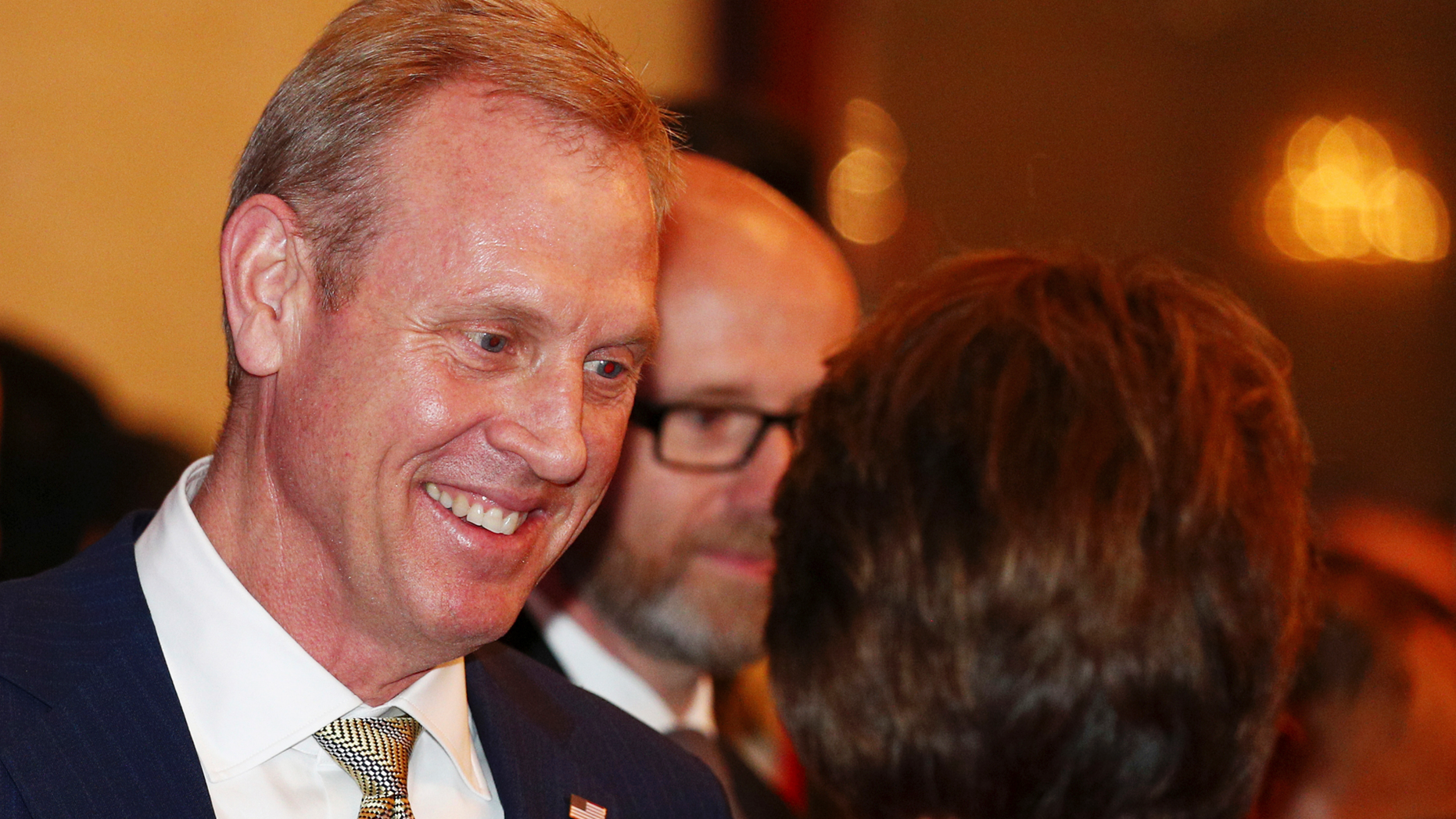 Acting U.S. Secretary of Defense Patrick Shanahan, left, arrives for the opening dinner of the 18th International Institute for Strategic Studies (IISS) Shangri-la Dialogue, an annual defense and security forum in Asia, in Singapore, Friday, May 31, 2019. (AP Photo/Yong Teck Lim)