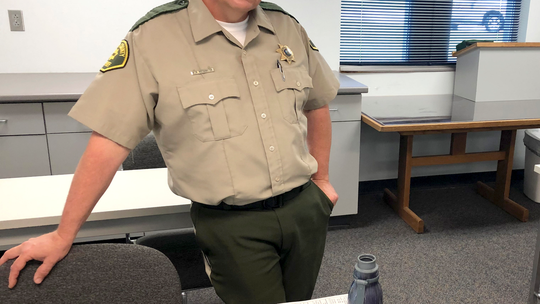 In this Wednesday, June 12, 2019 photo Cedar County, Iowa Sheriff Warren Wethington poses for a portrait at his office in Tipton, Iowa. Wethington has declared that his jail will not book any inmates arrested by police officers in the town of Durant, saying he cannot vouch for the officers' integrity. Wethington issued the directive last month, which applies to anyone arrested by the Durant Police Department. Wethington says one of Durant's three officers has a history of being untruthful and using questionable force and the chief knows this but hired him anyway. (AP Photo/Ryan J. Foley)