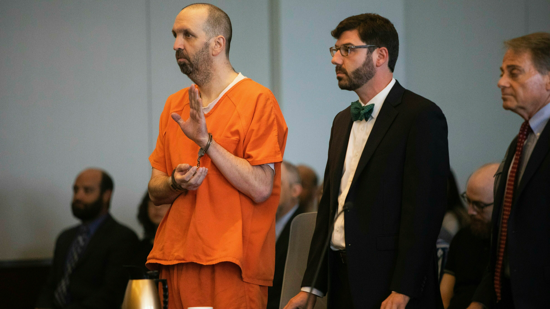 Craig Hicks pleads guilty to first-degree murder of three young Muslim men murdered in 2015 in a Chapel Hill apartment on Wednesday, June 12, 2019, at the Durham County Courthouse. Hicks will serve a life sentence without parole for the murder of his neighbors at Finley Forest condominiums: Deah Barakat, 23, his wife Yusor Abu-Salha, 21, and his sister, Razan Abul Salha, 19 years old. (Long Travis / The News & Observer via AP)