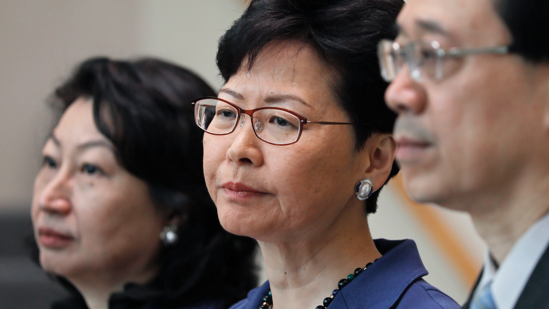 From right, Hong Kong Secretary for Security John Lee, Hong Kong Chief Executive Carrie Lam and Secretary of Justice Teresa Cheng listen to reporters questions during a press conference in Hong Kong Monday, June 10, 2019. Lam signaled Monday that her government will go ahead with proposed amendments to its extradition laws after a massive protest against them. (AP Photo/Vincent Yu)