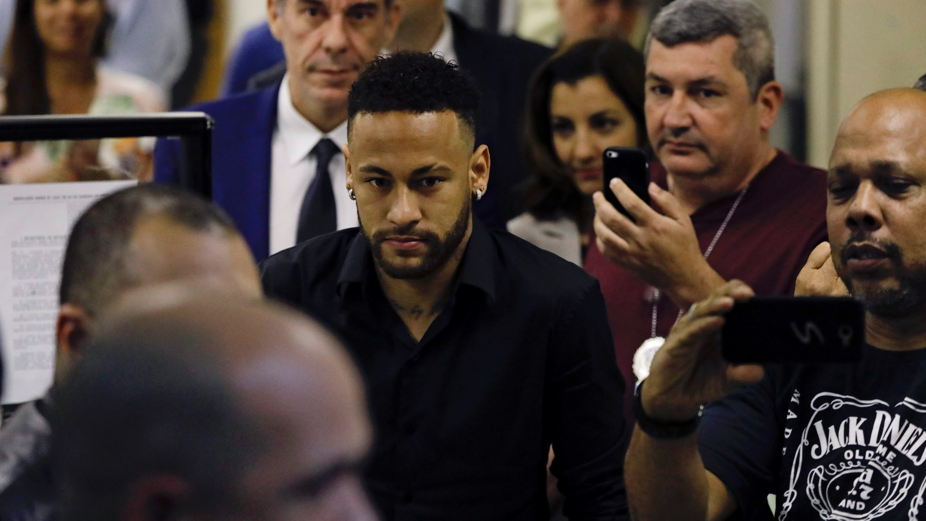 Brazilian soccer player Neymar leaves police headquarters in Rio de Janeiro, Brazil, Thursday, June 6, 2019. Neymar went to the headquarters in an investigation linked to a woman’s rape allegation against him. (AP Photo/Leo Correa)