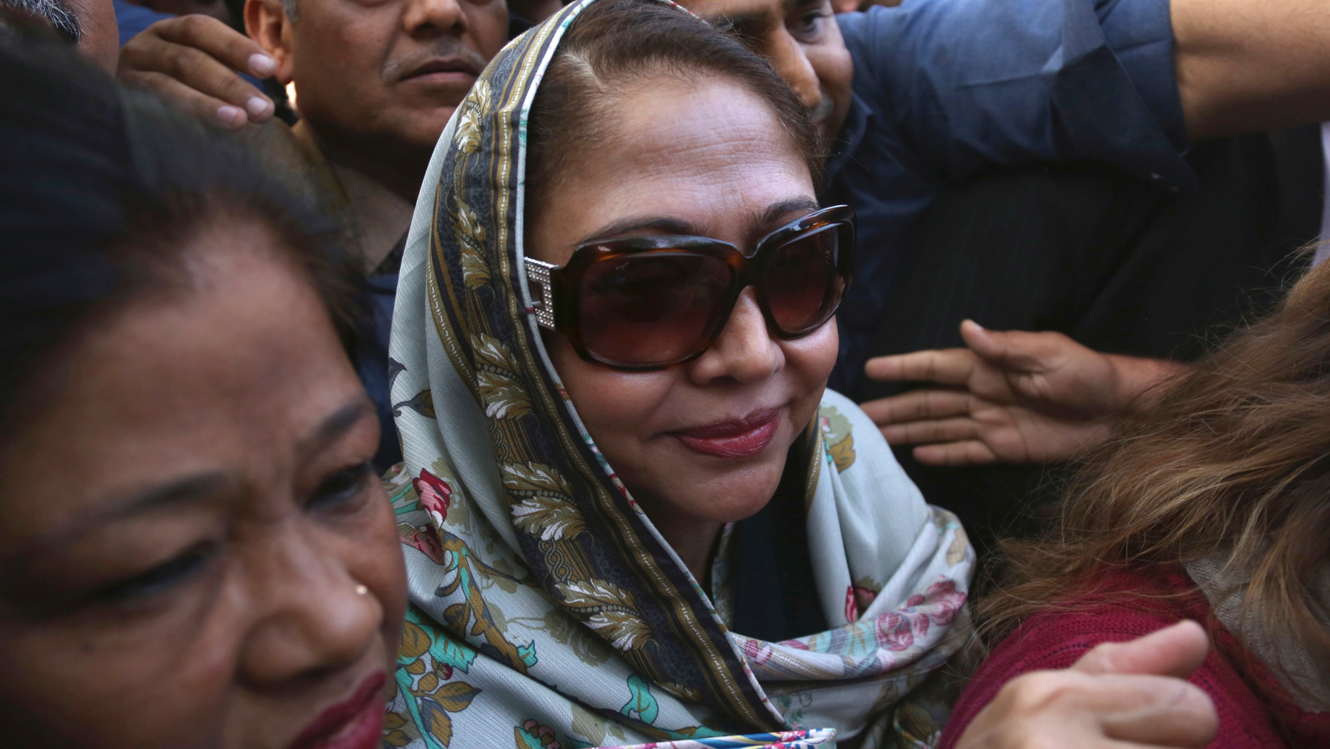 FILE - In this Jan. 7, 2019 file photo, Faryal Talpur, center, sister of former Pakistani president Asif Ali Zardari, arrives to appear in a court in Karachi, Pakistan. Talpur has been arrested by Pakistan’s anti-graft body in connection with a multi-million-dollar money laundering case following rejection of her bail by a court. Talpur, also a politician, was taken into custody Thursday, June 13, by the National Accountability Bureau in Islamabad. The latest development came days after a court rejected bail requests from Zardari and Talpur, drawing condemnation from the opposition, which has accused Prime Minister Imran Khan of victimizing his opponents. (AP Photo/Shakil Adil)