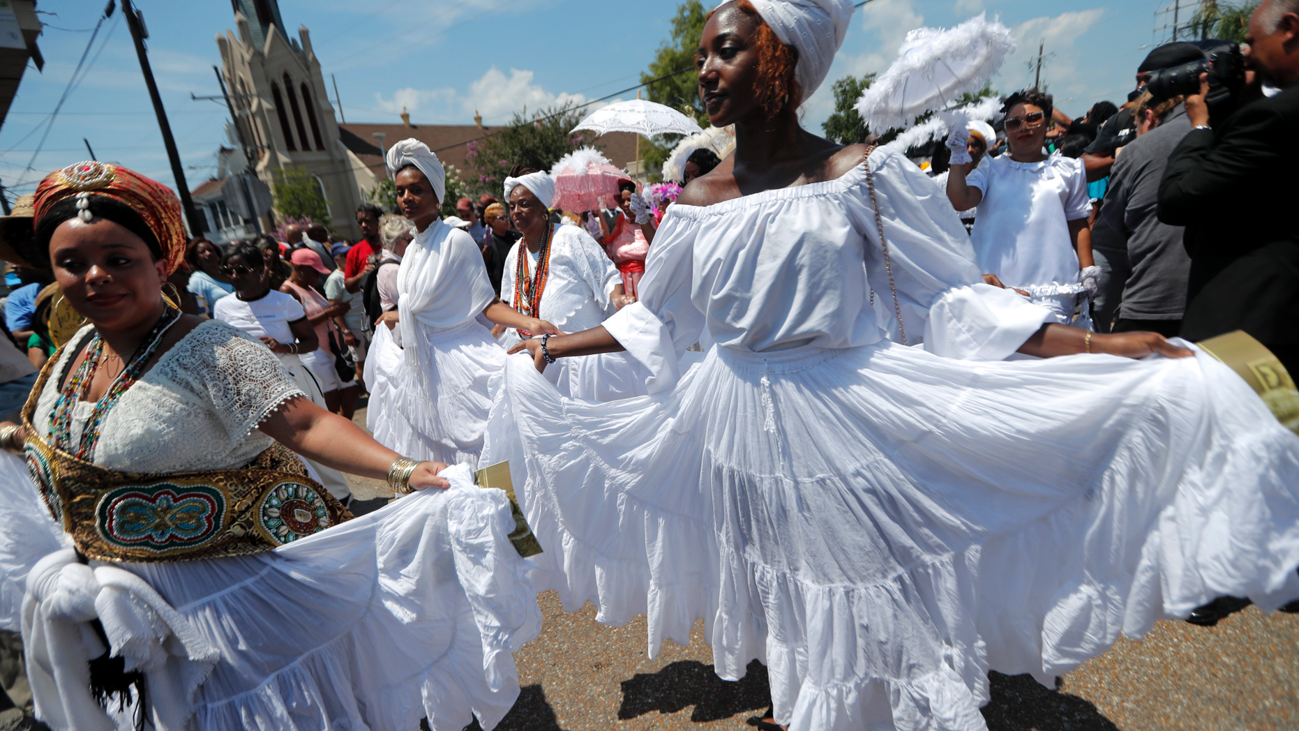 A funeral procession for Leah Chase from St. Peter Claver Church to her restaurant in New Orleans on Monday. (AP Photo/Gerald Herbert)