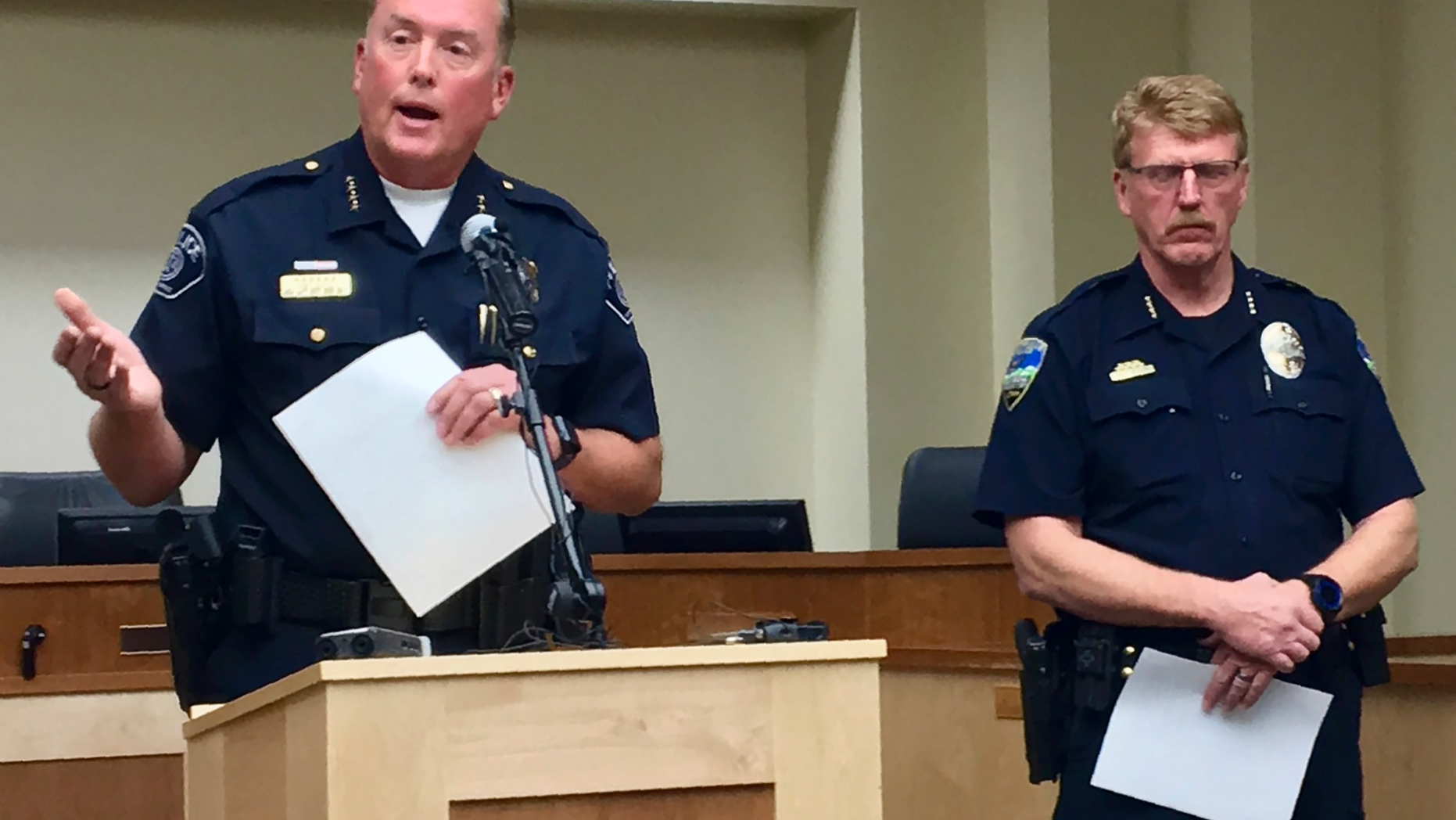 Woods Cross, Utah, Police Chief Chad Soffe, left, and Centerville Police Chief Paul Child speak at a news conference Monday, June 10, 2019, in Woods Cross. Soffe said a Woods Cross police officer who pulled his gun on a 10-year-old child will continue to work amid an independent review of the incident. Jerri Hrubes said the white officer pulled his gun on her son, DJ, who is black, while he was playing on the front lawn Thursday, June 6, 2019. (AP Photo/Morgan Smith)