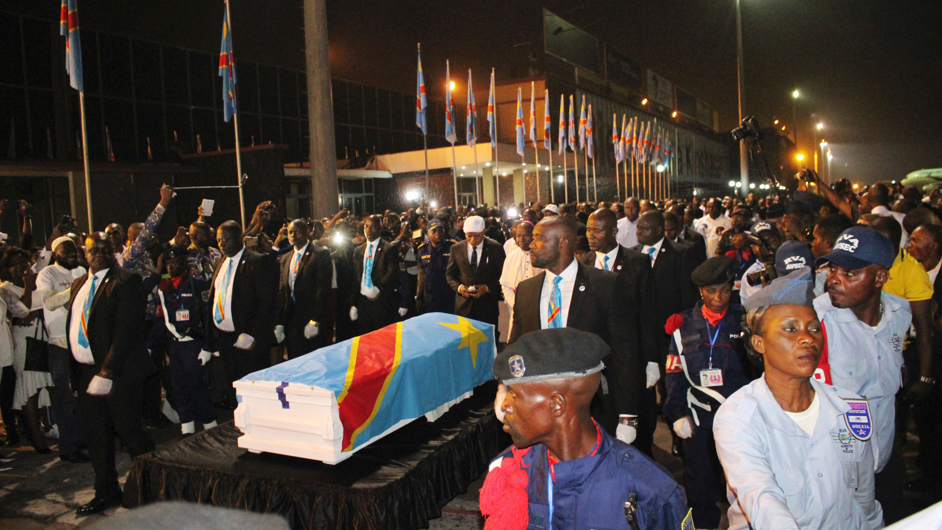 The coffin carrying the remains of longtime Congolese opposition leader Etienne Tshisekedi arrives at Kinshasa airport Thursday, May 30, 2019. The body of Tshisekedi, father of the current Congolese President Felix Tshisekedi, died in Brussels in February 2017, was returned to home soil Thursday night for burial more than two years after his death, after a political standoff ended. (AP Photo/John Bompengo)