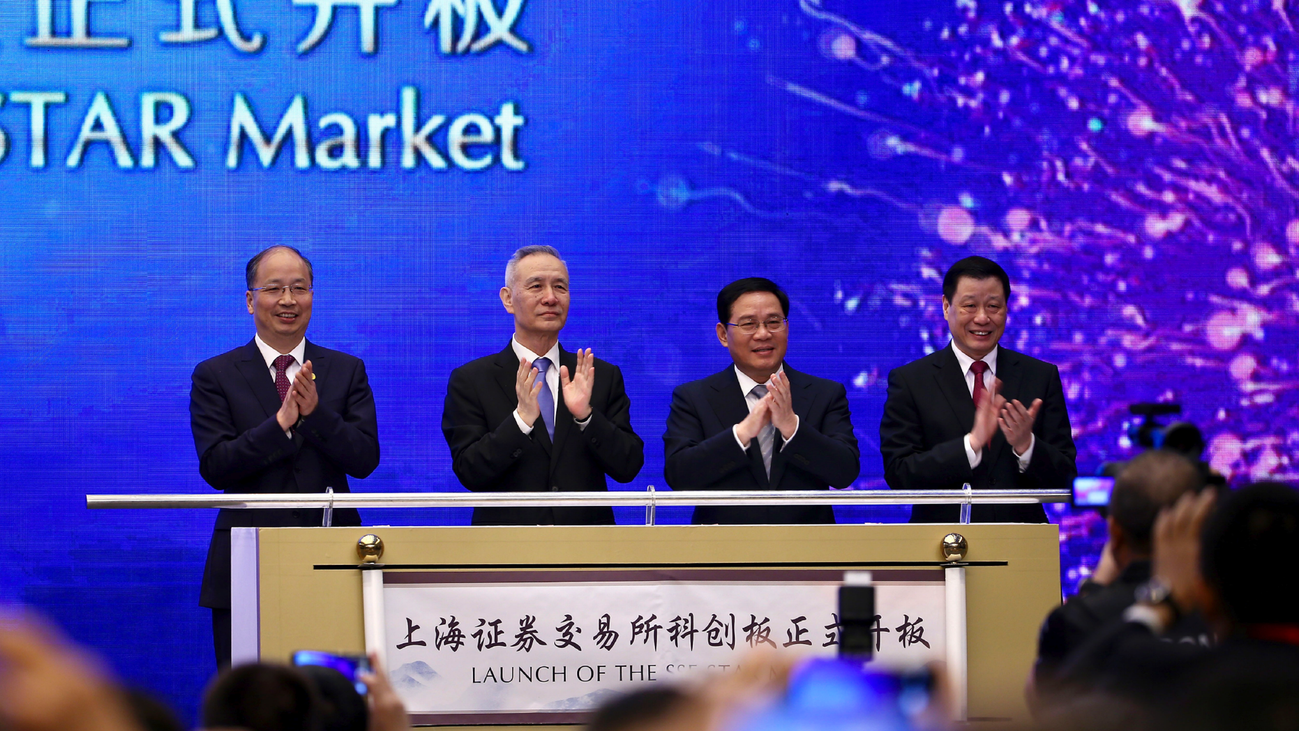 From left; Yi Huiman, Chairman of China Securities Regulatory Commission, Chinese Vice Premier Liu He, Shanghai Party Secretary Li Qiang, Shanghai mayor and Ying Yong applaud during a ceremony for the launch of the SSE STAR Market, previously referred to as the Shanghai Science and Technology Innovation Board, in Shanghai, Thursday, June 13, 2019. Chinese media say the country's top trade negotiator has told a forum in Shanghai that