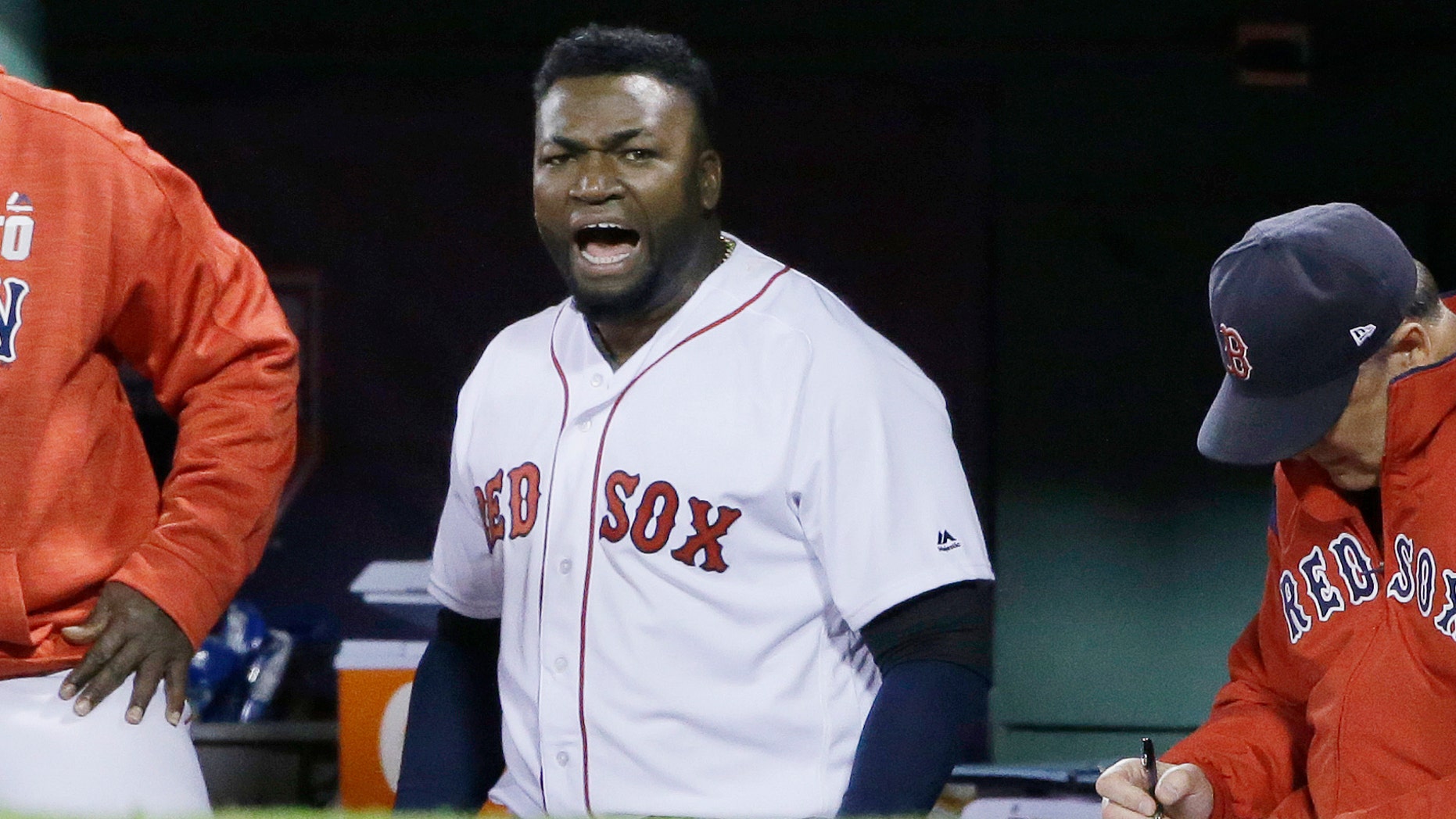 FILE - In this Oct. 10, 2016, file photo, Boston Red Sox designated hitter David Ortiz encourages the crowd from the dugout during the eighth inning in Game 3 of baseball's American League Division Series against the Cleveland Indians in Boston. Former Boston Red Sox slugger Ortiz was shot and wounded in his native Dominican Republic, his father told ESPN on Sunday, June 9, 2019. (AP Photo/Elise Amendola, File)