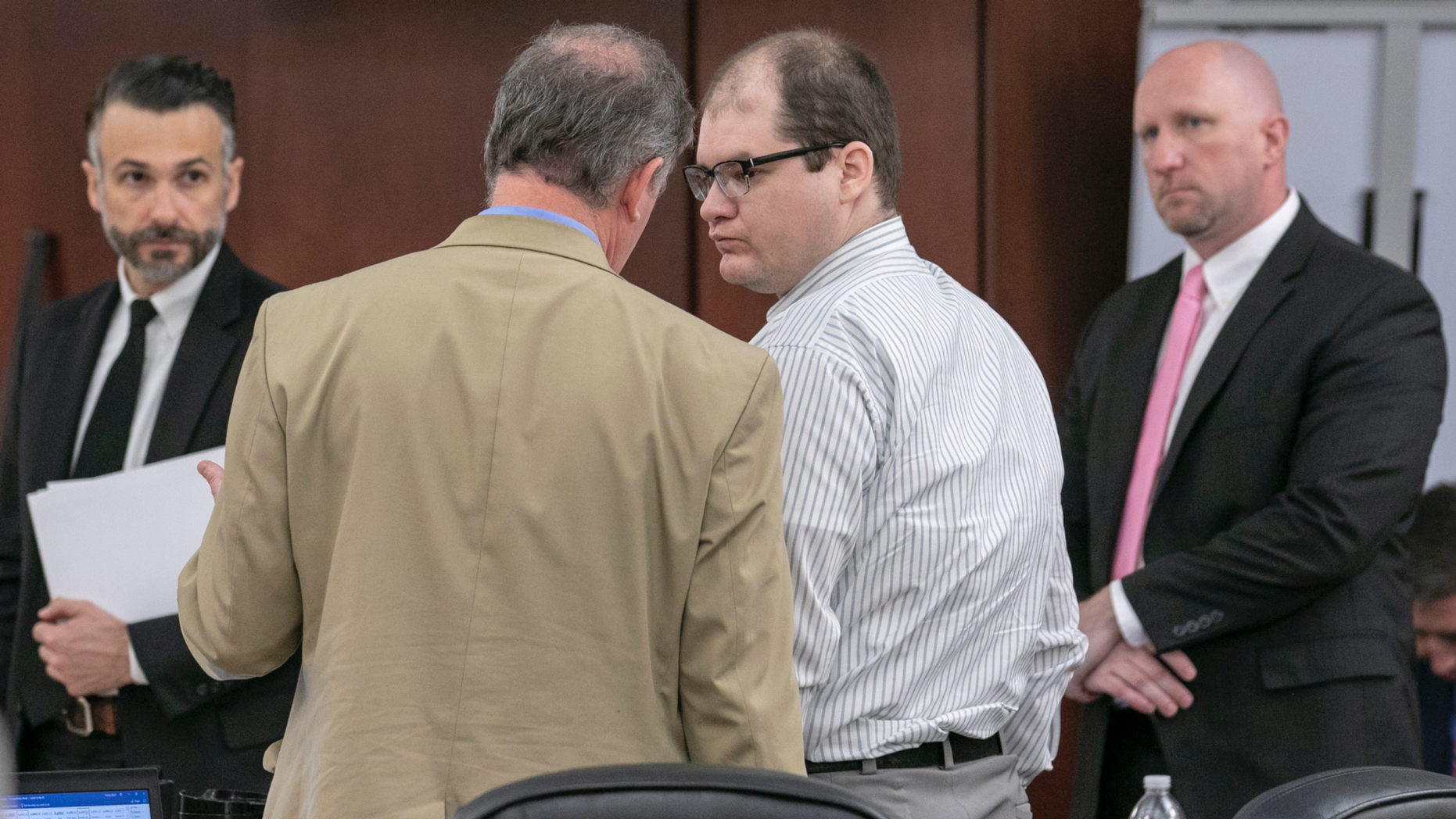 Defense attorney Boyd Young speaks with Tim Jones in the center during the sentencing phase of his trial in Lexington, SC Timothy Jones, Jr. was convicted of murder of his 5 young children in 2014 (Tracy Glantz / The State via AP, Pool).