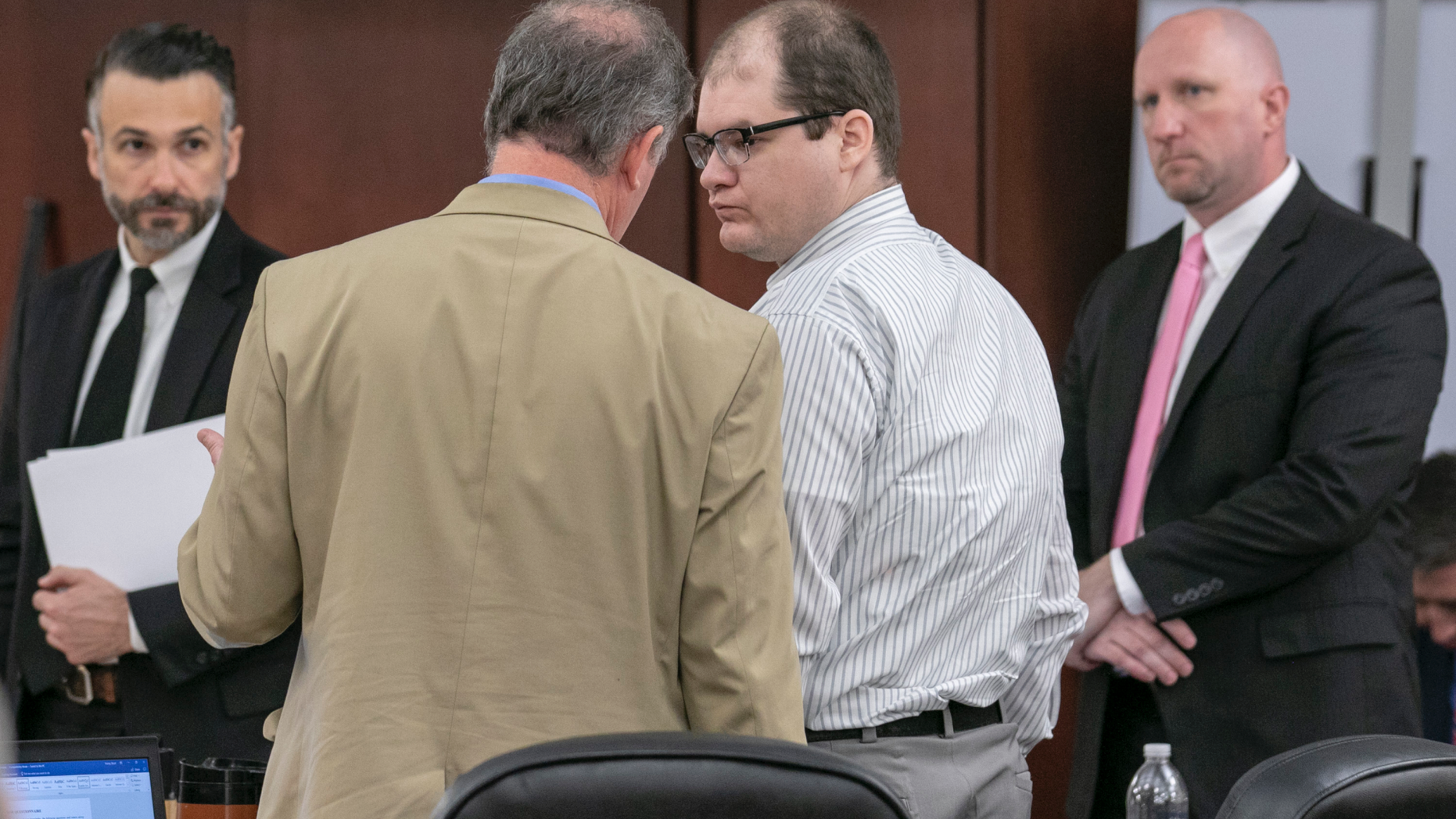 Defense attorney Boyd Young talks with Tim Jones, center, during the sentencing phase of his trial in Lexington, S.C. Timothy Jones, Jr. was found guilty of killing his 5 young children in 2014. (Tracy Glantz/The State via AP, Pool)
