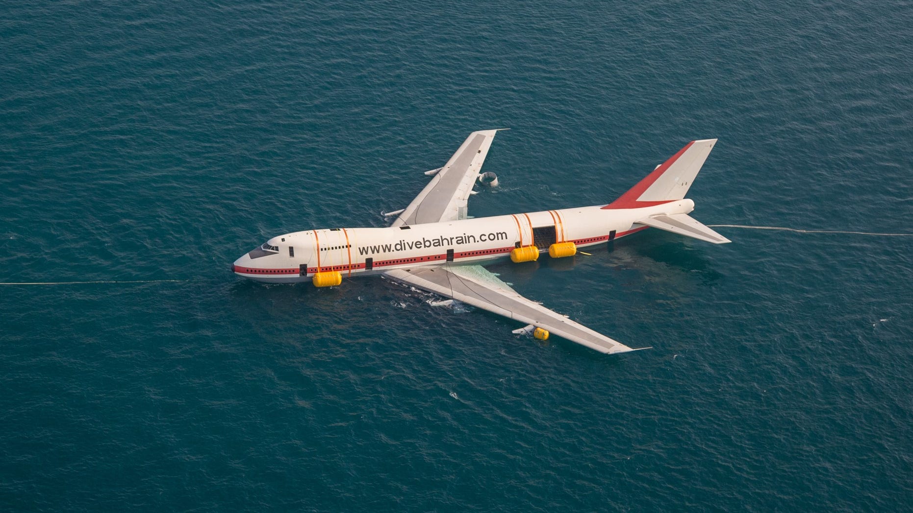 The Boeing 747 was towed out to sea to be sunk as part of what's being called an eco-friendly project.