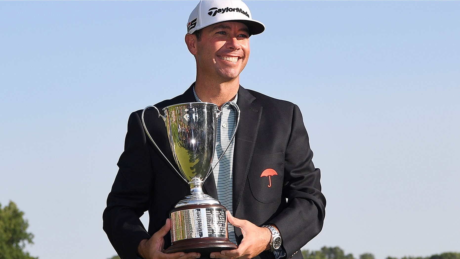 Chez Reavie, winner of the Travelers Championship golf tournament poses with the trophy, Sunday, June 23, 2019, in Cromwell, Conn. (AP Photo/Jessica Hill)