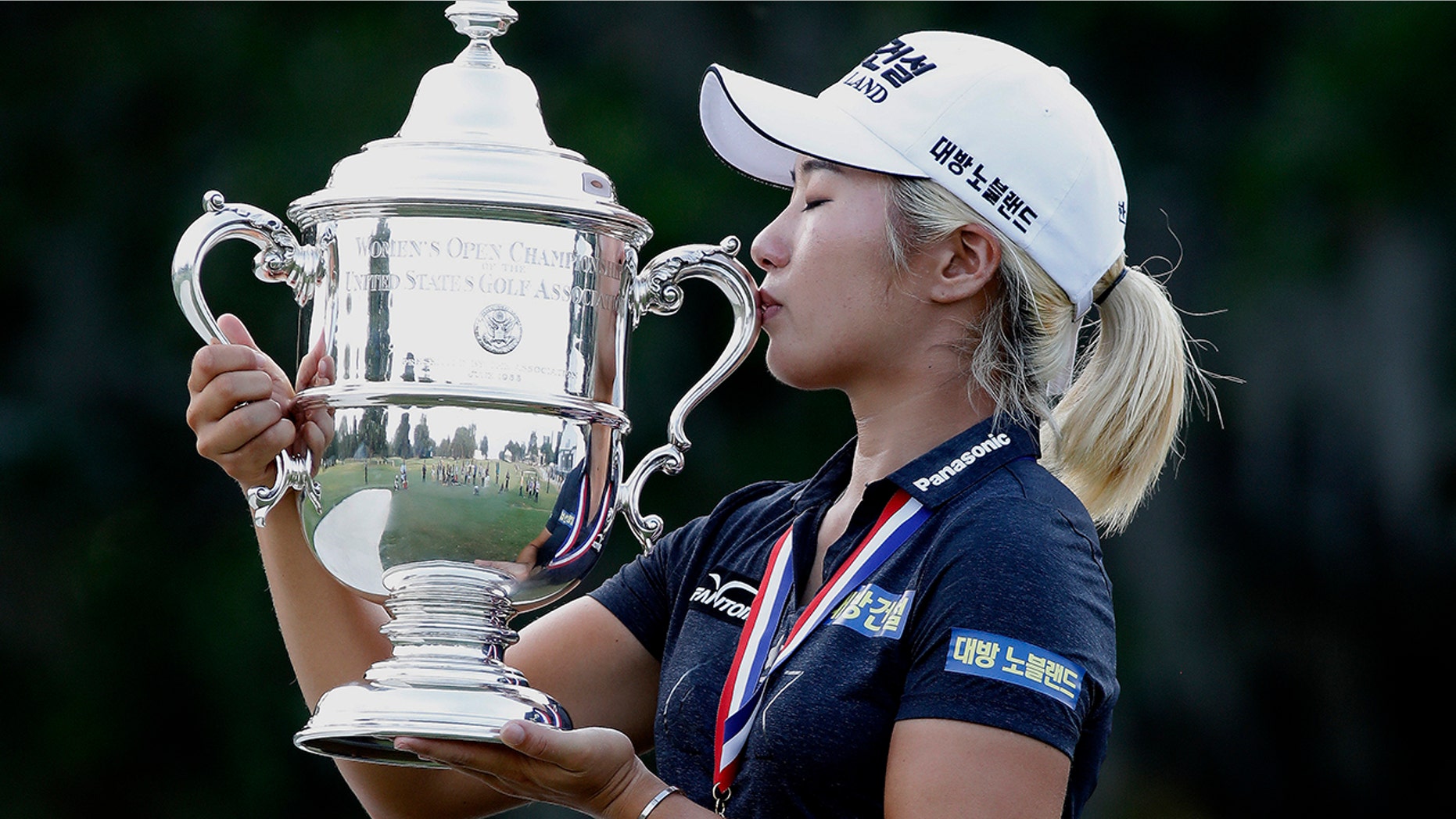 Jeongeun Lee6 of South Korea, kisses the championship trophy after winning the final round of the U.S. Women's Open golf tournament, Sunday, June 2, 2019, in Charleston, S.C. (AP Photo/Mic Smith)