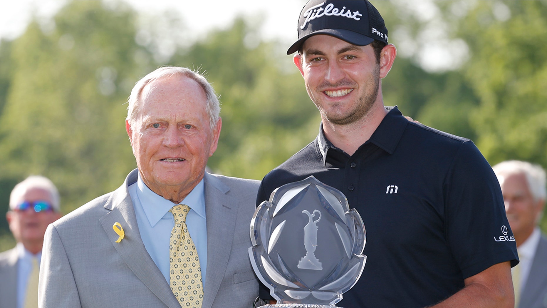 Jack Nicklaus, left, presents Patrick Cantlay with the trophy after Cantlay won the Memorial golf tournament Sunday, June 2, 2019, in Dublin, Ohio. (AP Photo/Jay LaPrete)