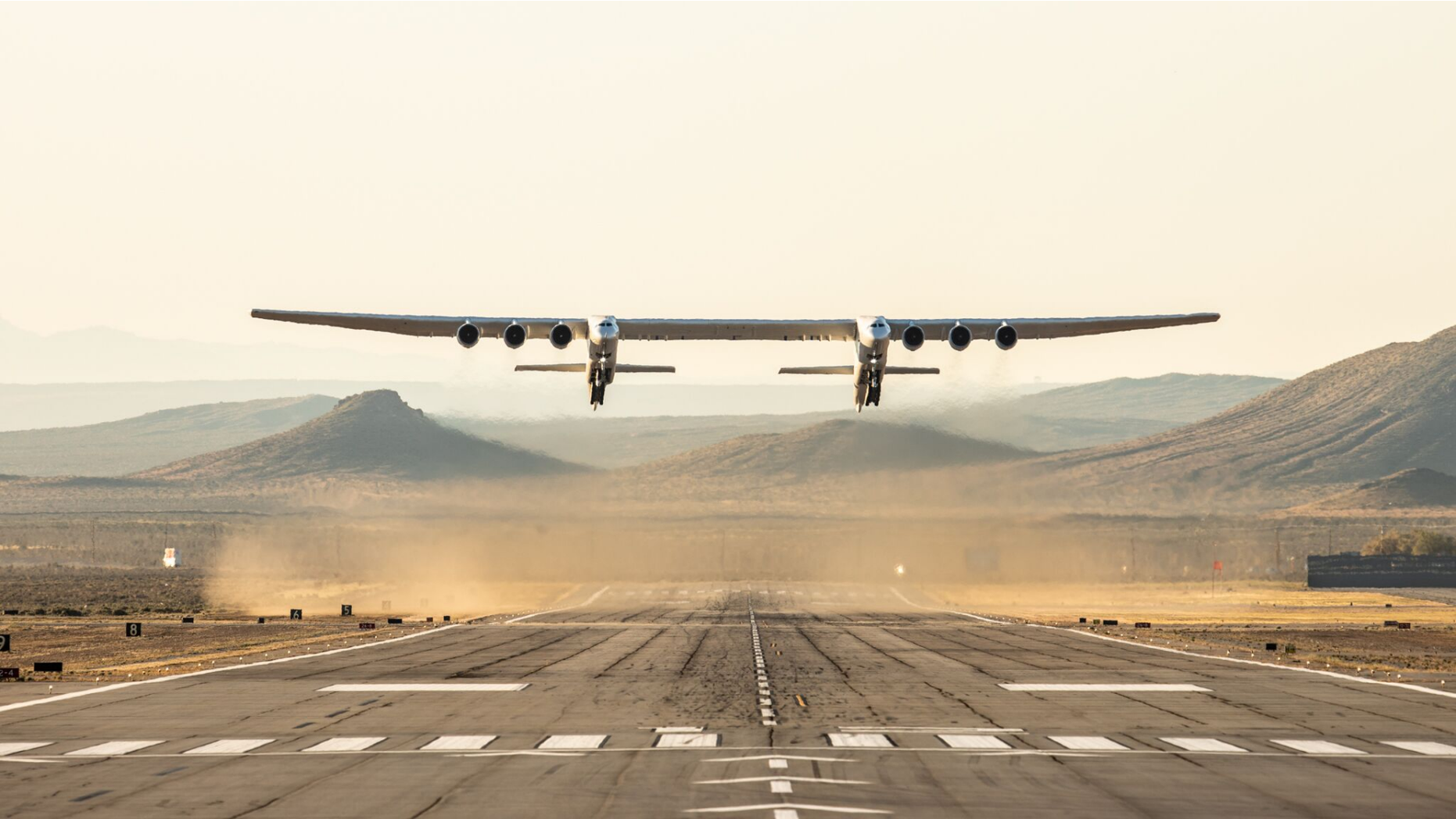 Stratolaunch's rocket carrier plane, the largest aircraft ever built, takes off from the Mojave Air and Space Port in Mojave, California during its first test flight on April 13, 2019.