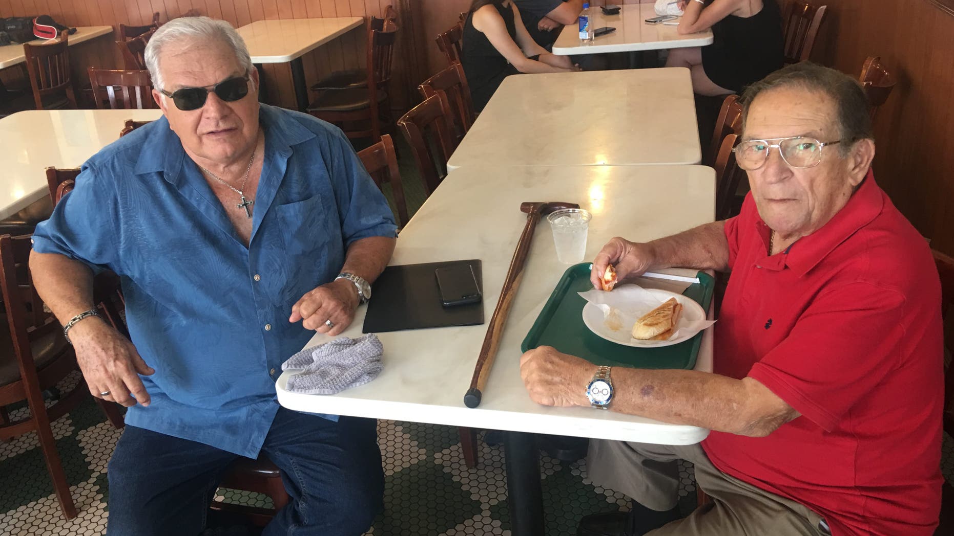 Emilio Izquierdo, 71, and Gonzalo Lopez, 83, have lunch at Little Havana staple Versailles. Socialism, Izquierdo fears, will “destroy America.” (Alex Pappas/Fox News).