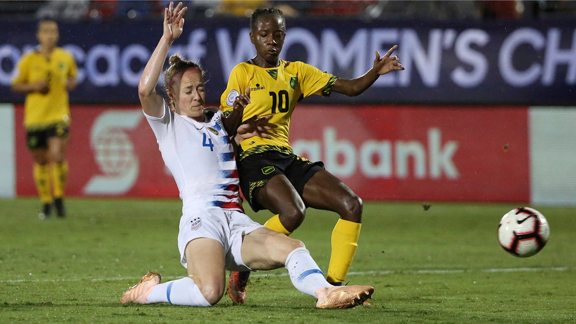 FILE - In this Oct. 14, 2018, file photo, United States defender Becky Sauerbrunn, left, defends against Jamaica forward Jody Brown during the second half of a CONCACAF women's World Cup qualifying tournament soccer match in Frisco, Texas. (AP Photo/Andy Jacobsohn, File)