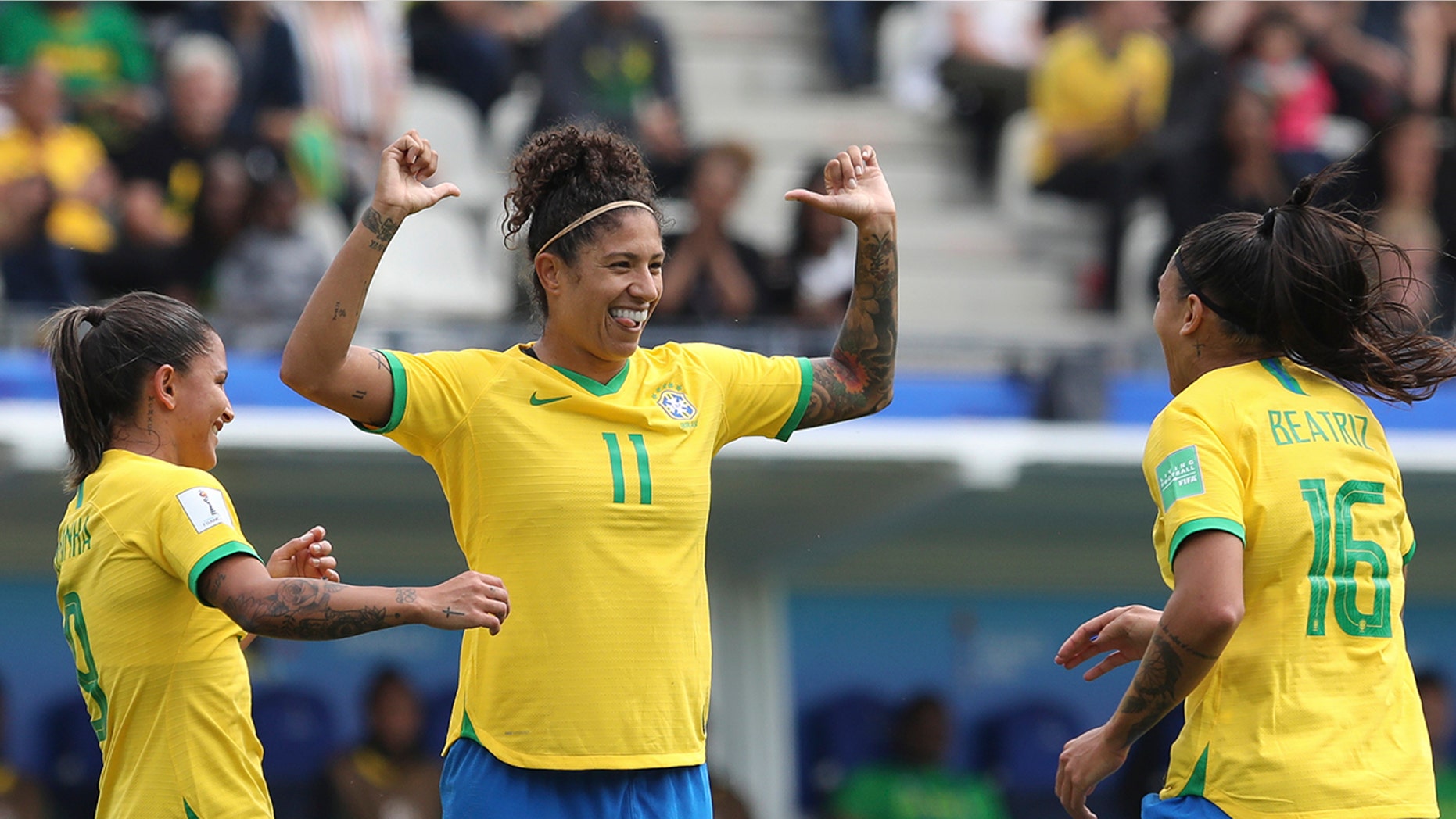 Brazil's Cristiane, center, celebrates after scoring her side's opening goal during the Women's World Cup Group C soccer match between Brazil and Jamaica in Grenoble, France, Sunday, June 9, 2019. (AP Photo/Laurent Cipriani)