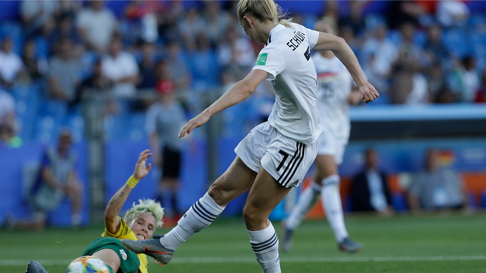 Germany's Lea Schueller, right, attempts a shot at goal in front of South Africa's Janine Van Wyk during the Women's World Cup Group B soccer match between South Africa and Germany at the Stade de la Mosson in Montpellier, France, Monday, June 17, 2019. (AP Photo/Claude Paris)