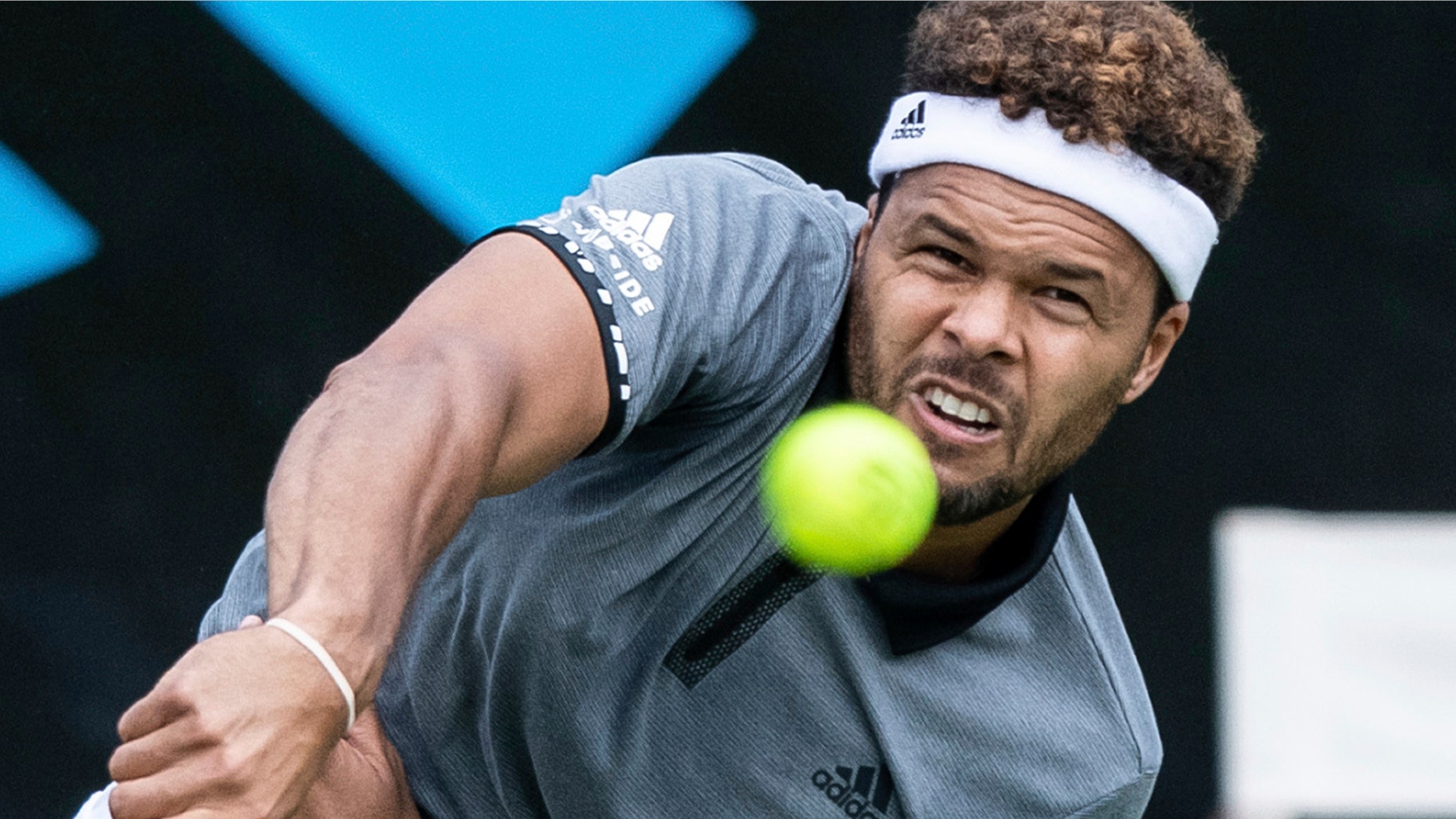Jo-Wilfried Tsonga serves the ball to Mischa Zverev during their first round match at the ATP tennis tournament in Stuttgart, Germany, Monday, June 10, 2019. (Silas Stein/dpa via AP)